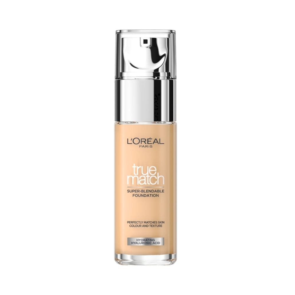 A close-up of a L'Oreal Paris foundation bottle with a silver cap and clear labeling.