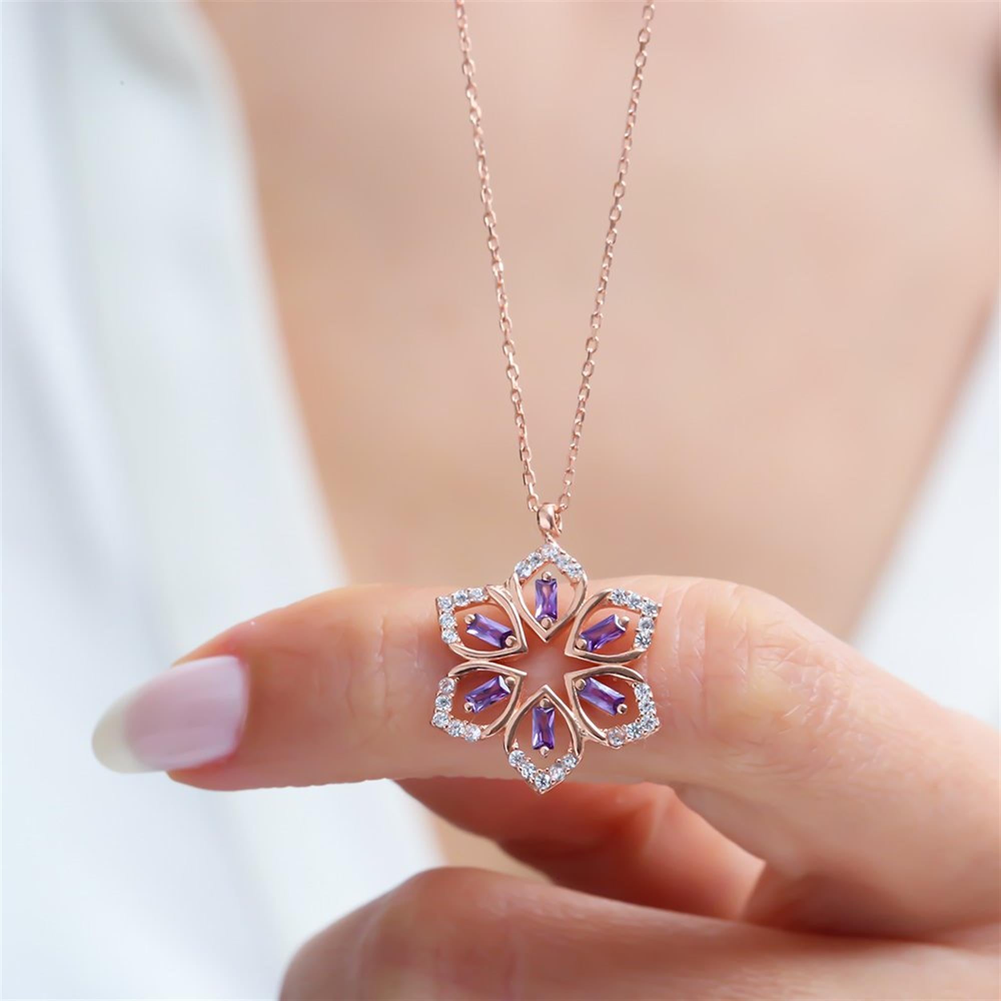 Mandala-inspired necklace featuring amethyst marquise crystals and rose gold plating – a symbol of balance and inner peace.