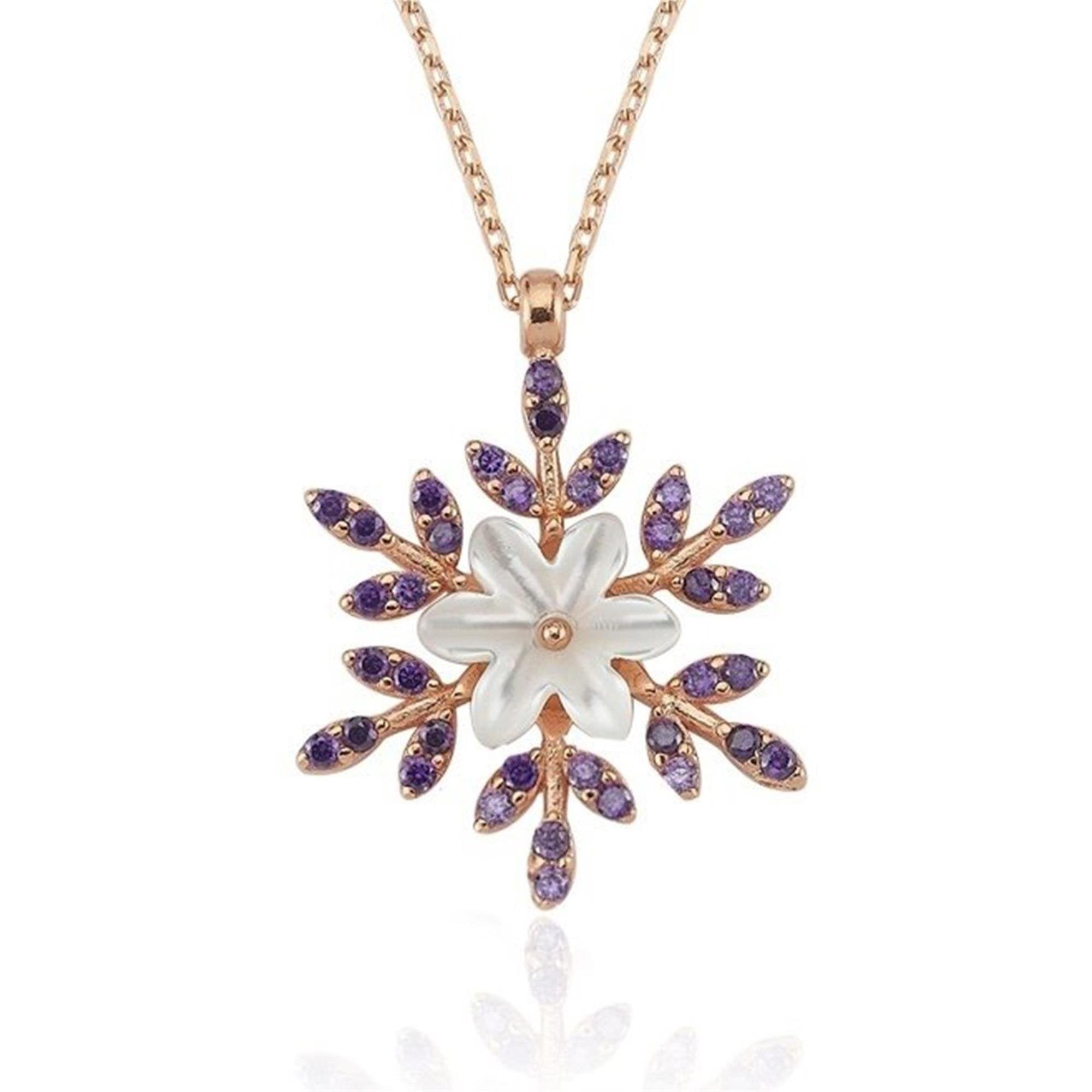 Rose gold necklace with a white flower centerpiece and amethyst stones forming a snowflake design