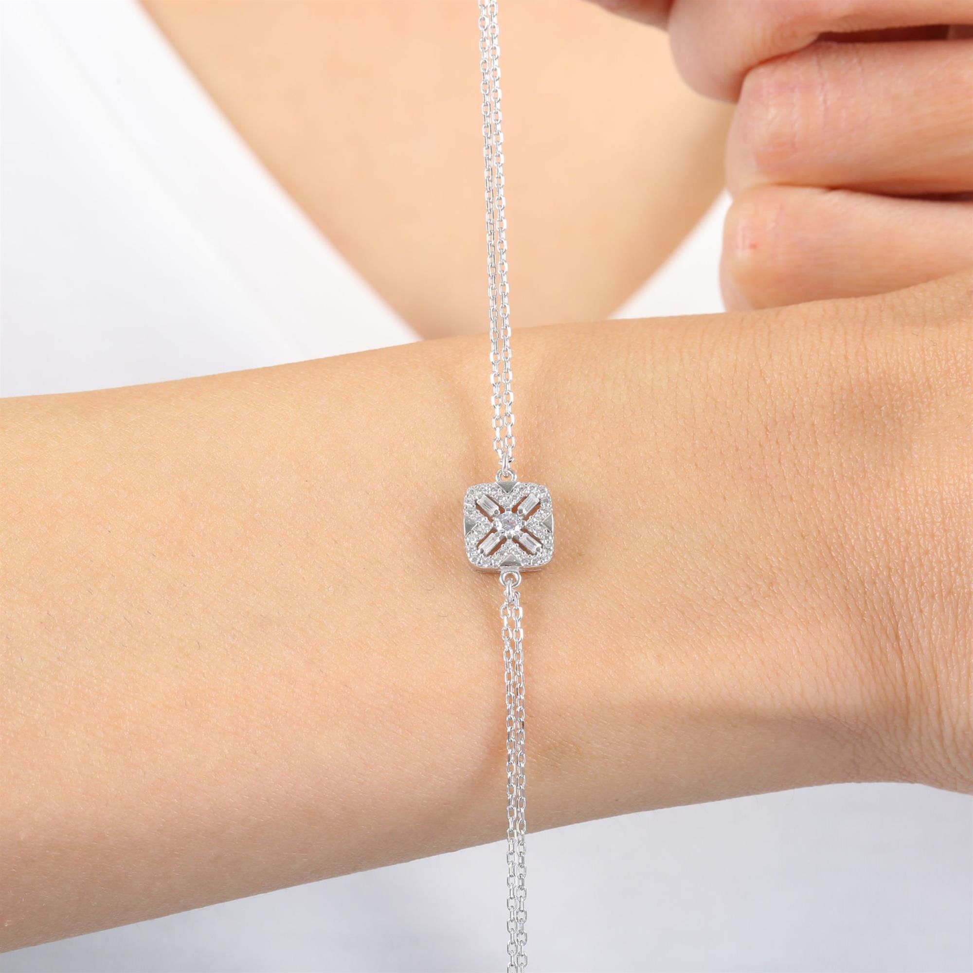 Sterling silver bracelet with square X-pattern charm and baguette-cut CZ stones – elegant geometric jewelry for women