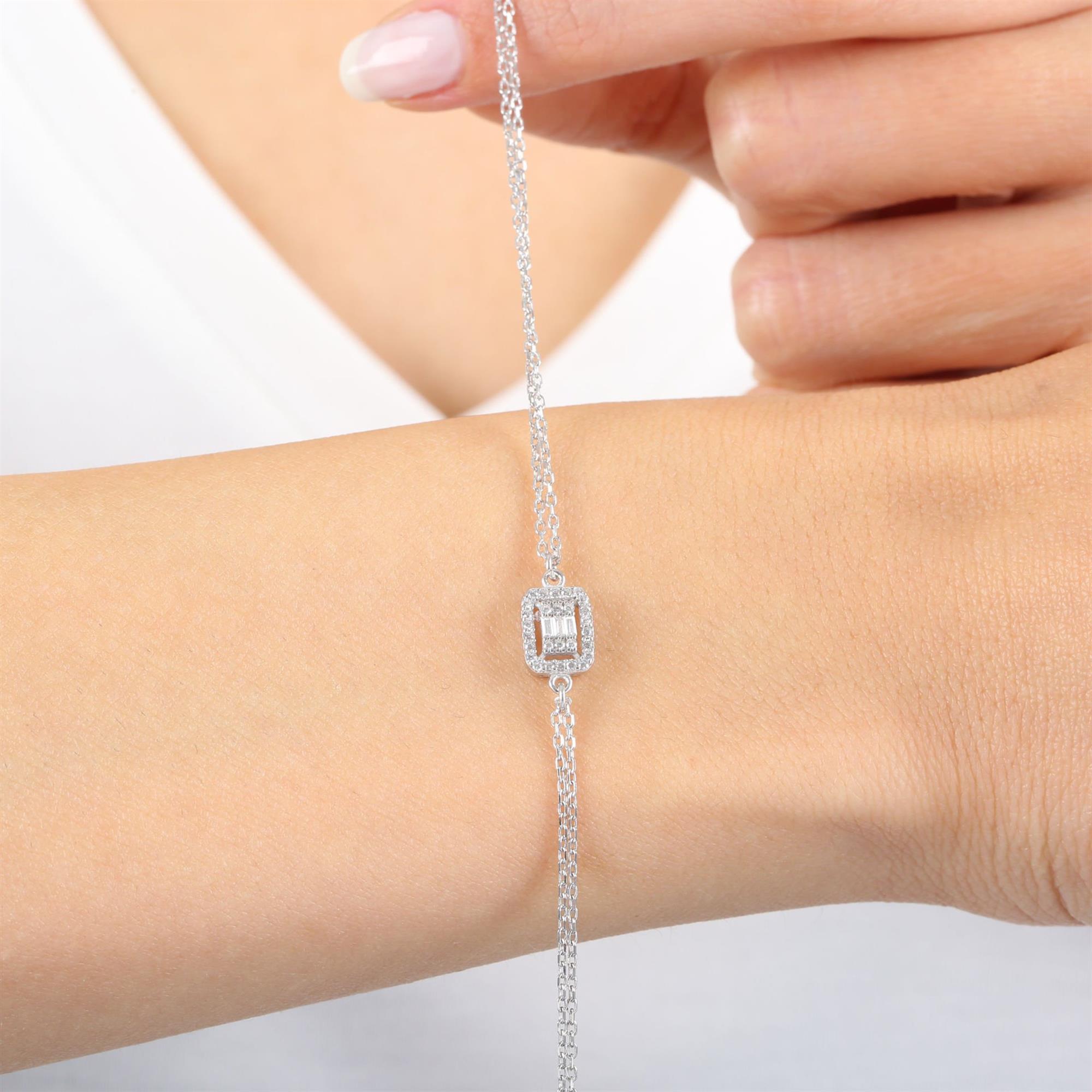 Elegant sterling silver bracelet with rectangular baguette-cut center stone and halo of CZ – minimalist sparkle jewelry for women