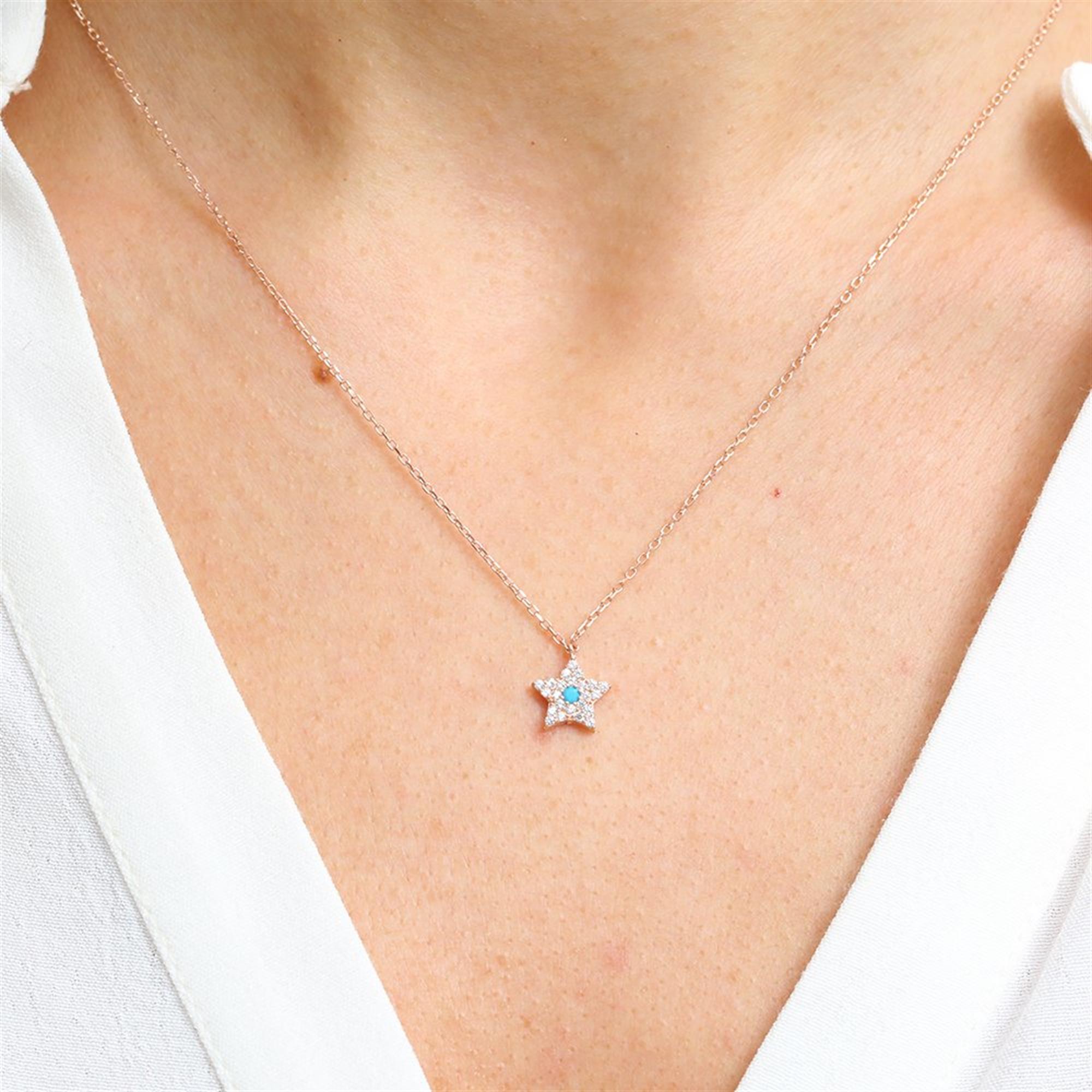 Rose Gold star necklace with a turquoise center stone and glittering zirconia for radiant everyday elegance.