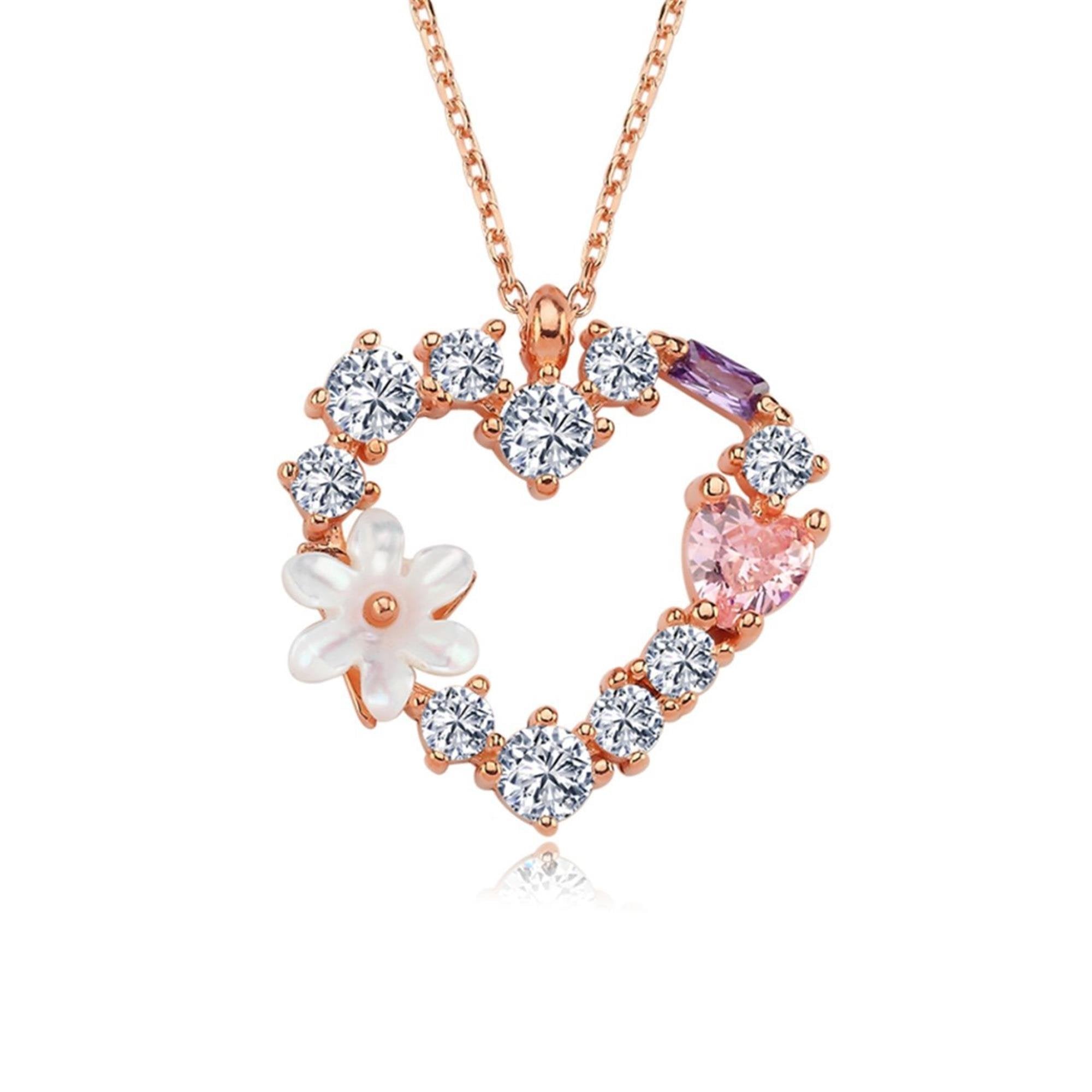 Rose gold heart necklace with zirconia stones, white magnolia flower and pink heart gemstone accent
