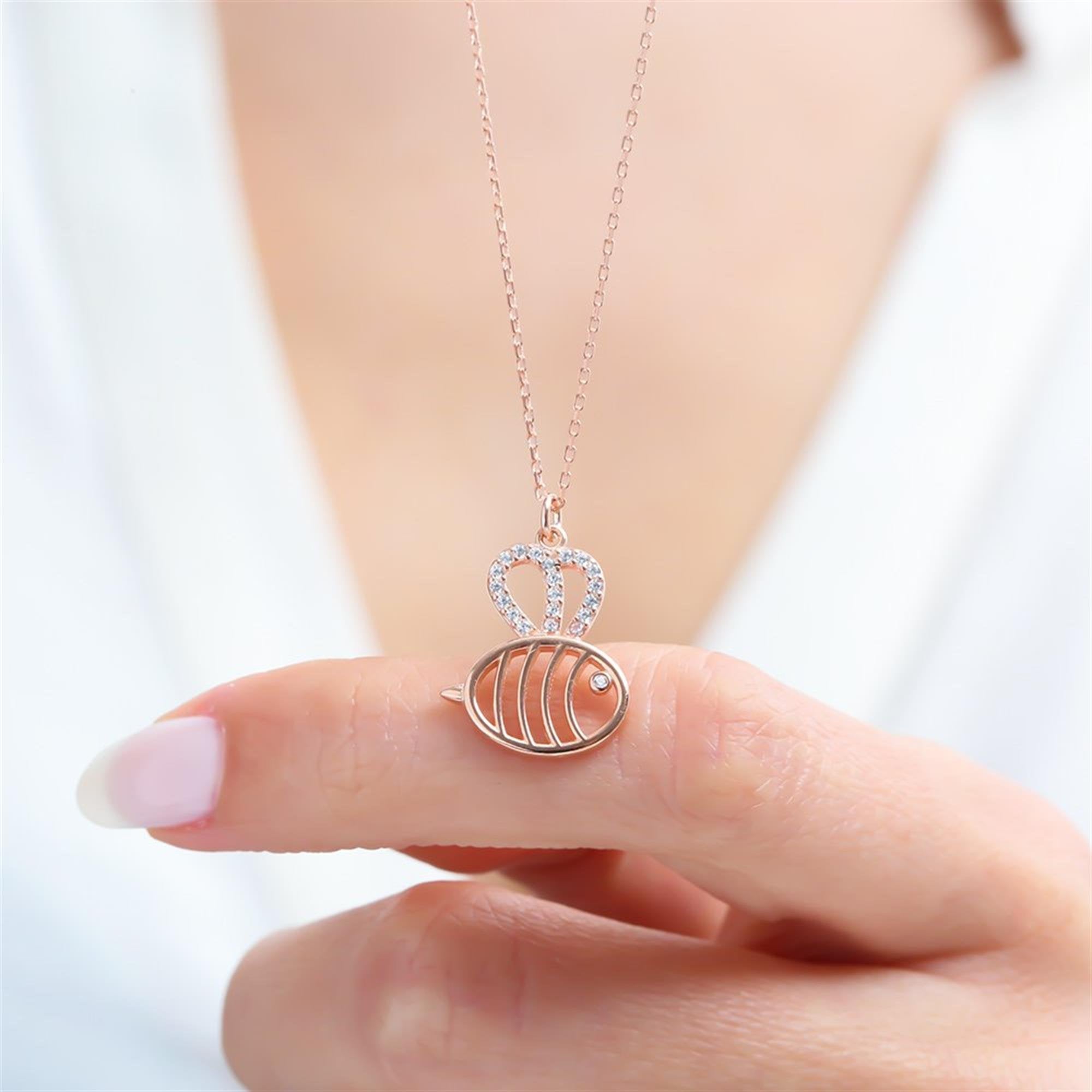 Rose gold fish necklace with sparkling crown – minimalist and symbolic 925 silver pendant.