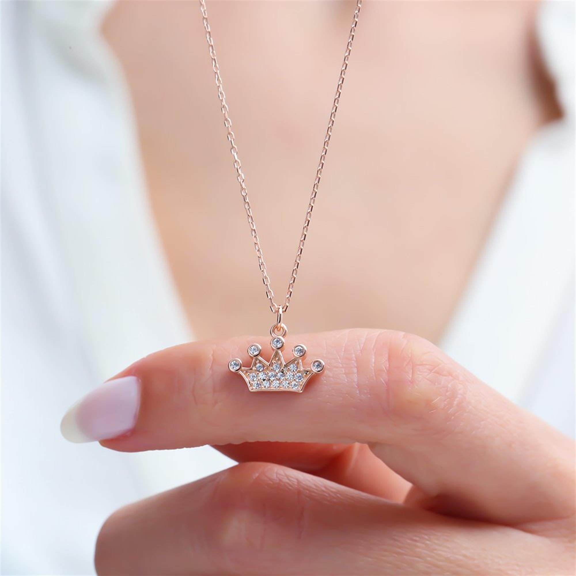 Rose gold crown necklace with sparkling zircon stones – perfect for a queenly touch.
