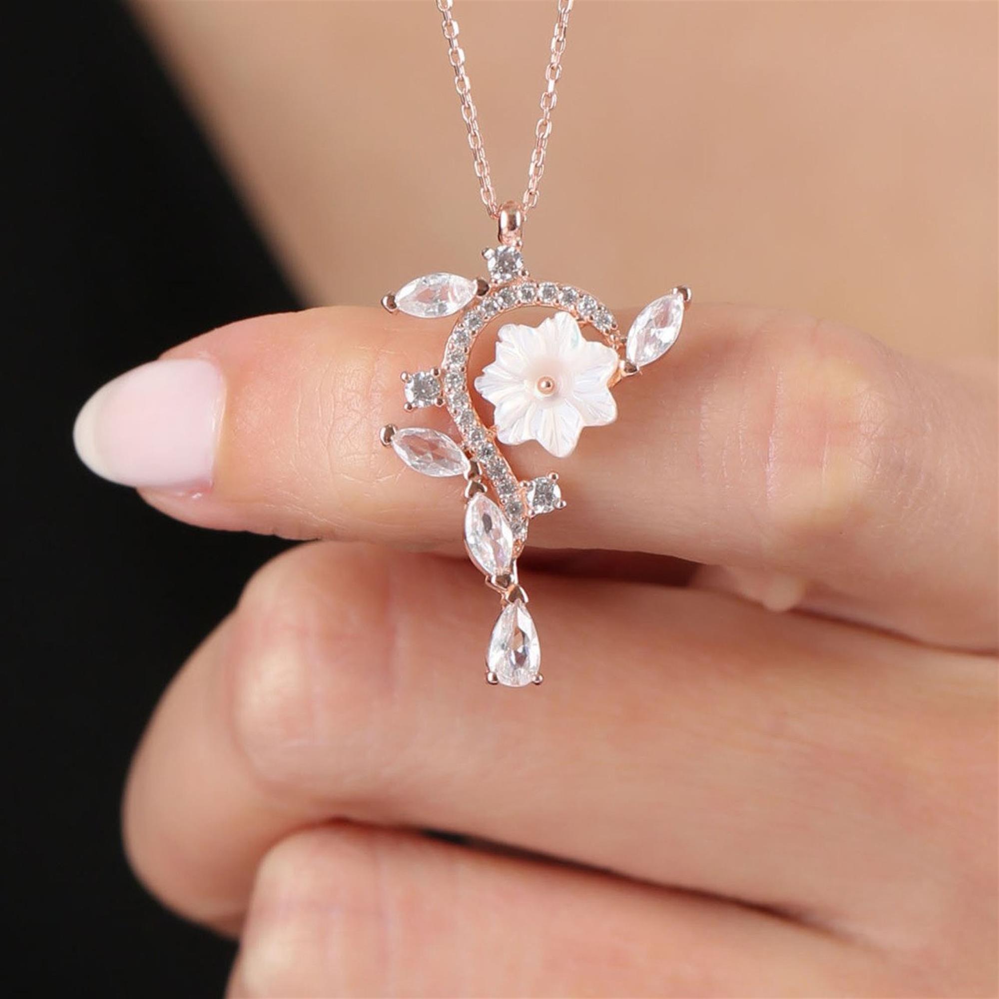Rose Gold floral necklace with white magnolia, marquise CZ leaves and crystal drop – asymmetric elegant pendant for women