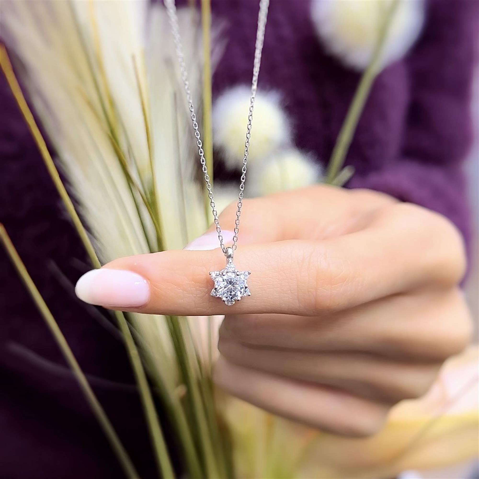 Sterling silver starburst necklace with diamond-look CZ stones