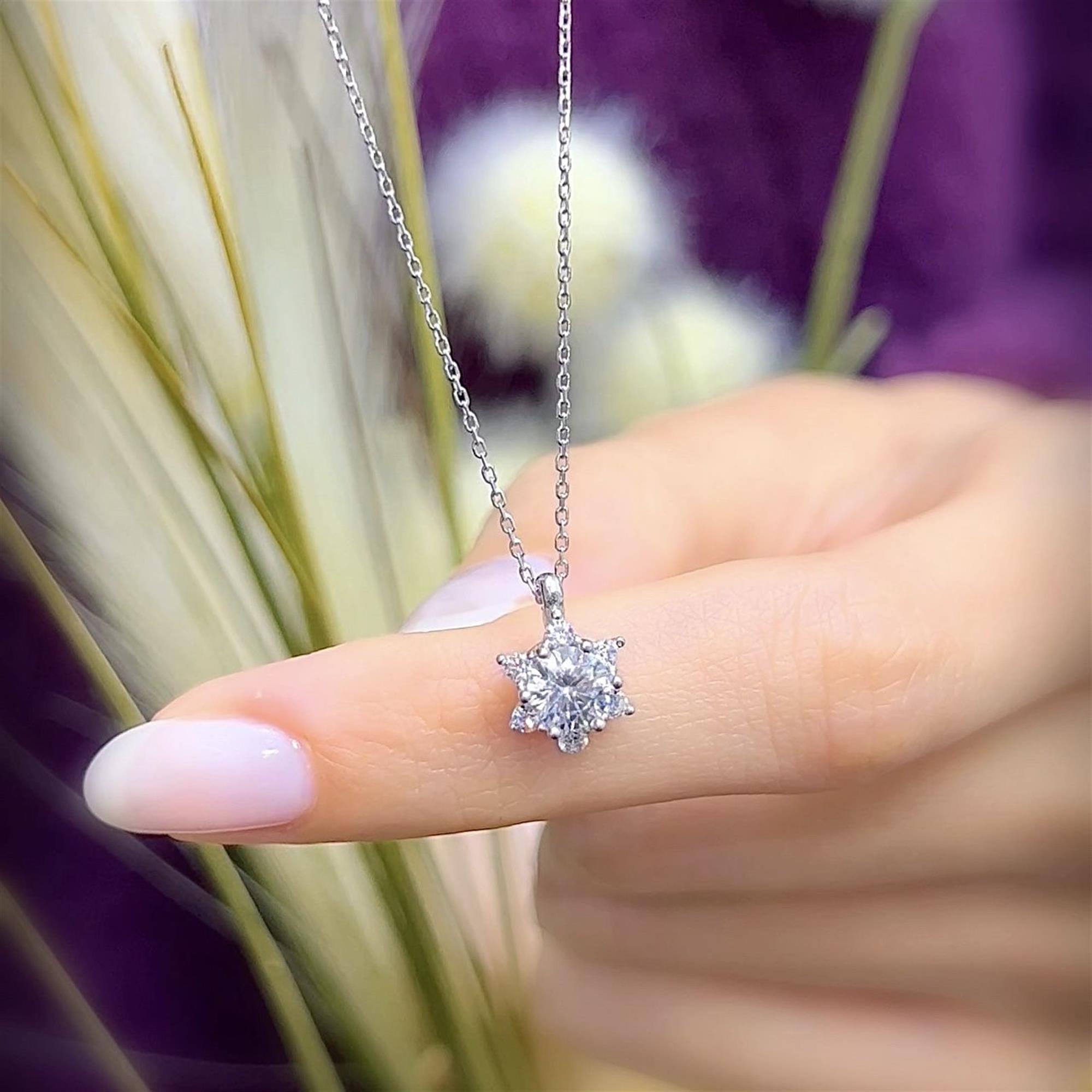 Sterling silver starburst necklace with diamond-look CZ stones – elegant everyday pendant gift for women