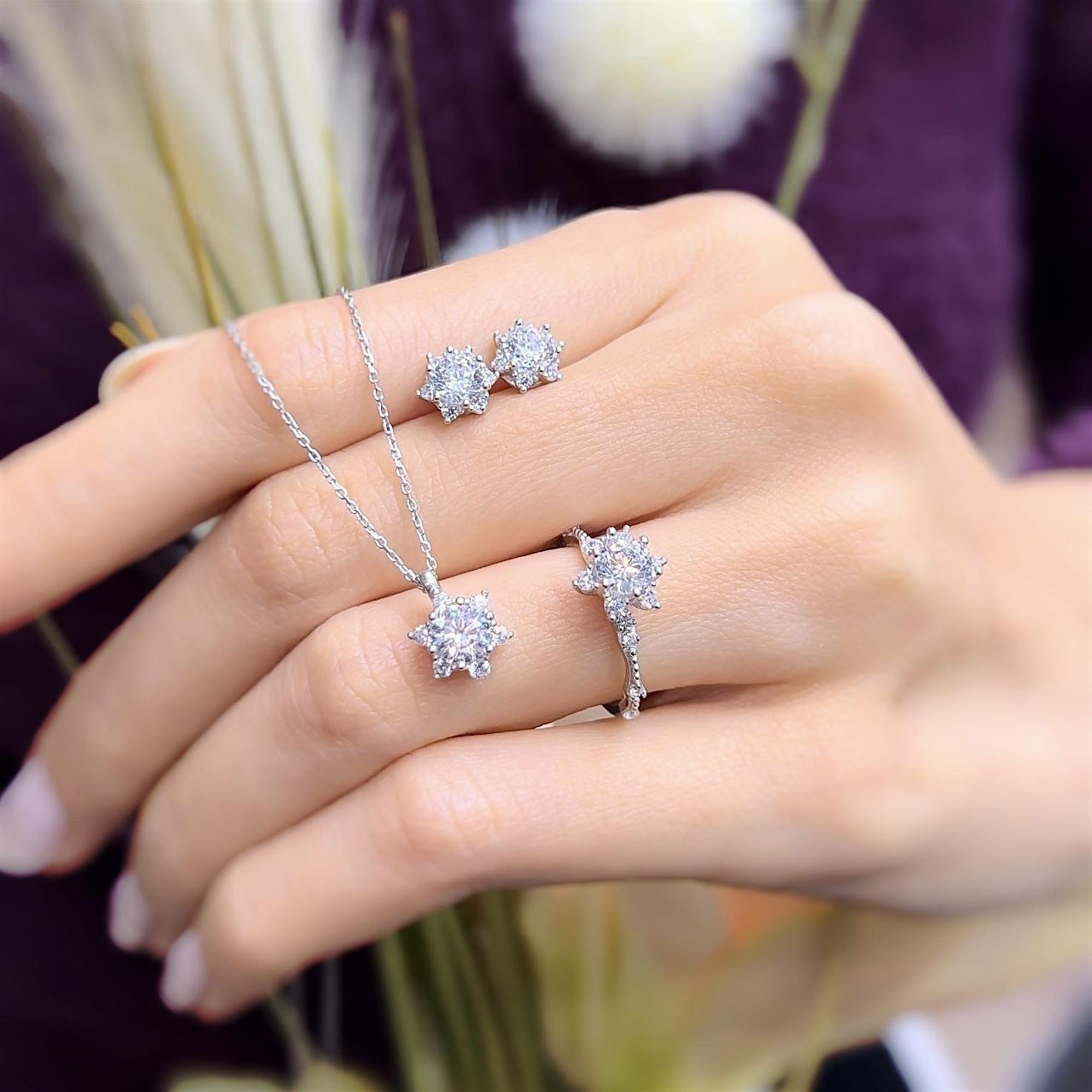 Sterling silver sunburst jewelry set with necklace, earrings, and ring featuring diamond-cut CZ stones – elegant gift set for women