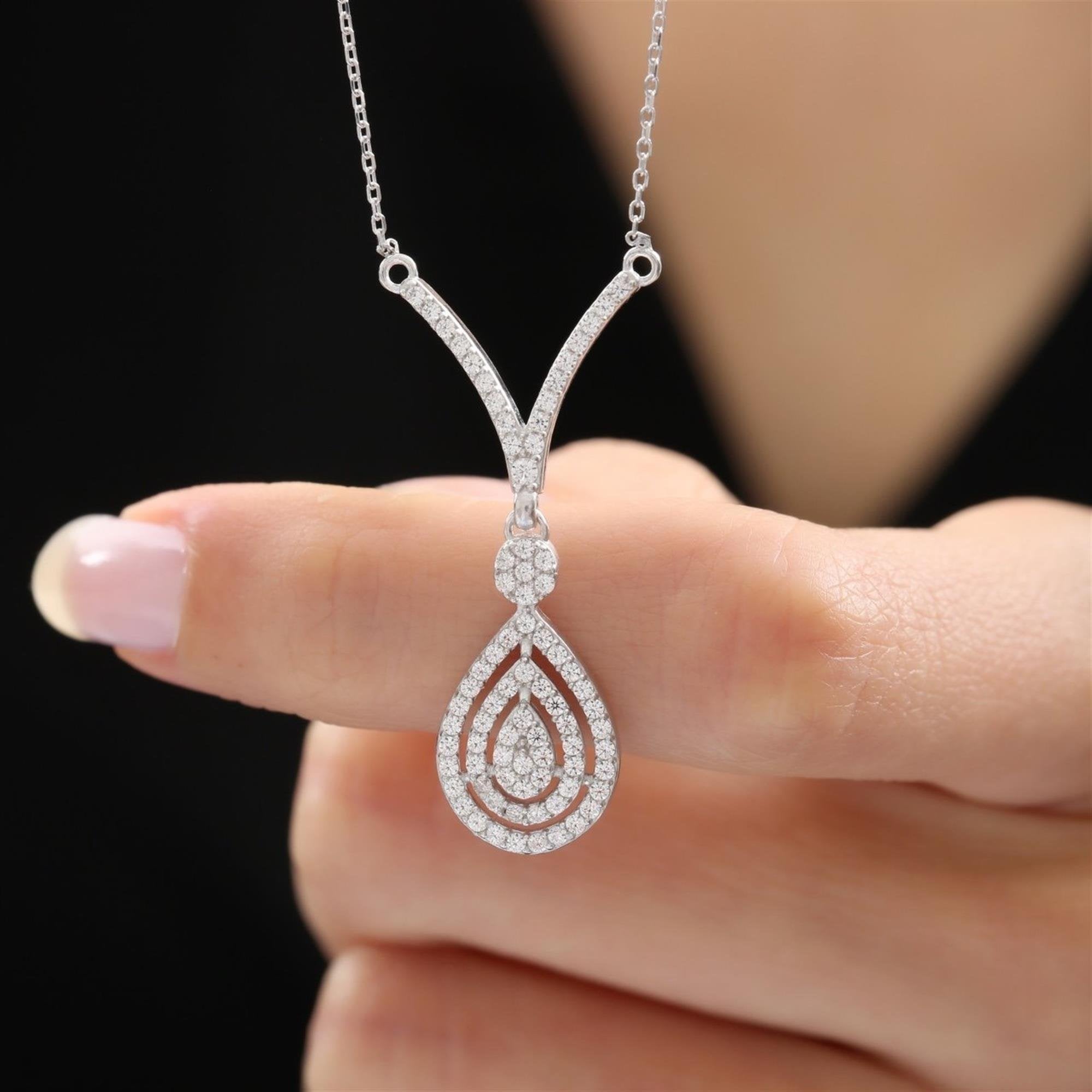 Elegant triple halo teardrop pendant with CZ stones and V-link silver chain – wedding or evening accessory