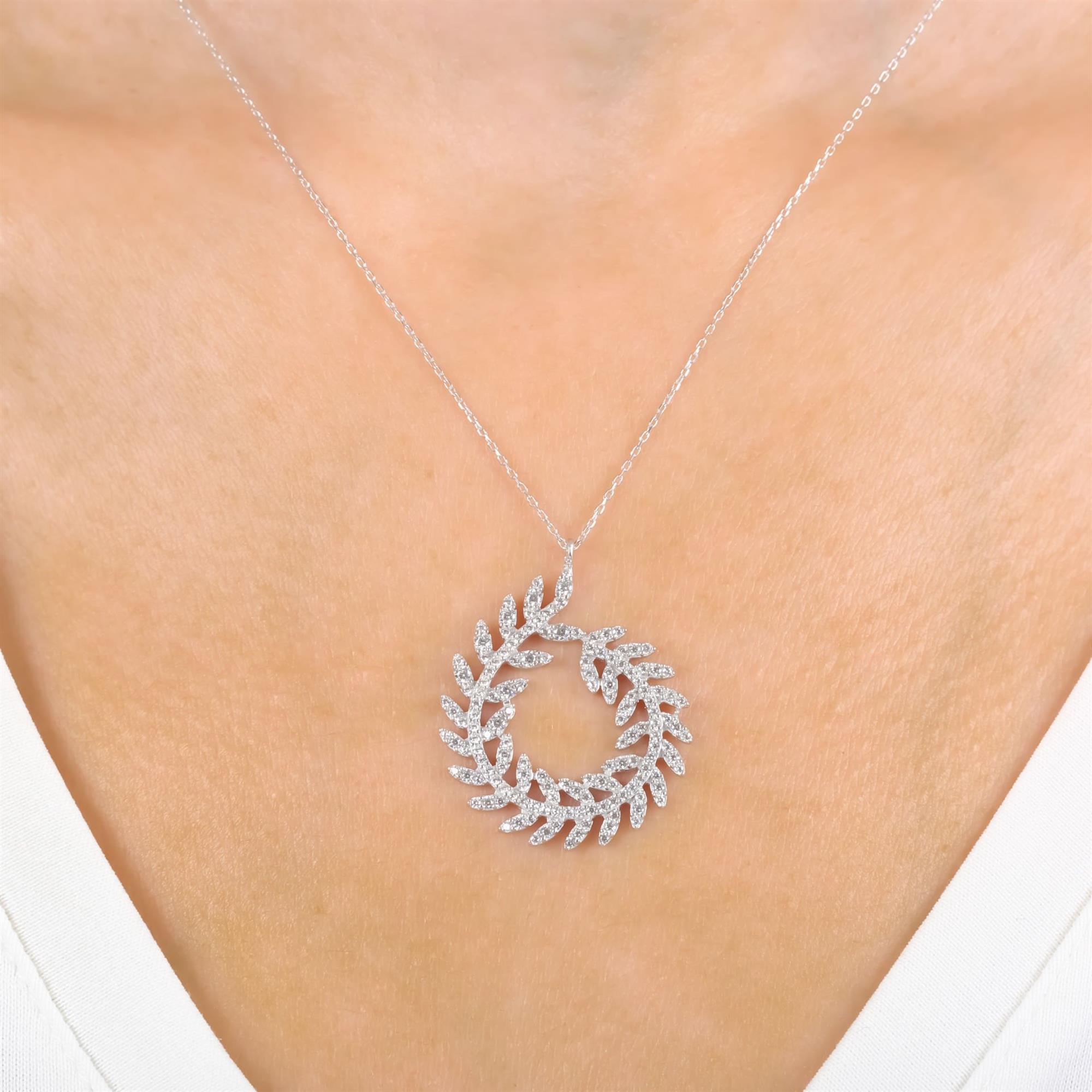 Sterling silver laurel wreath necklace with CZ leaf details in a circular openwork design