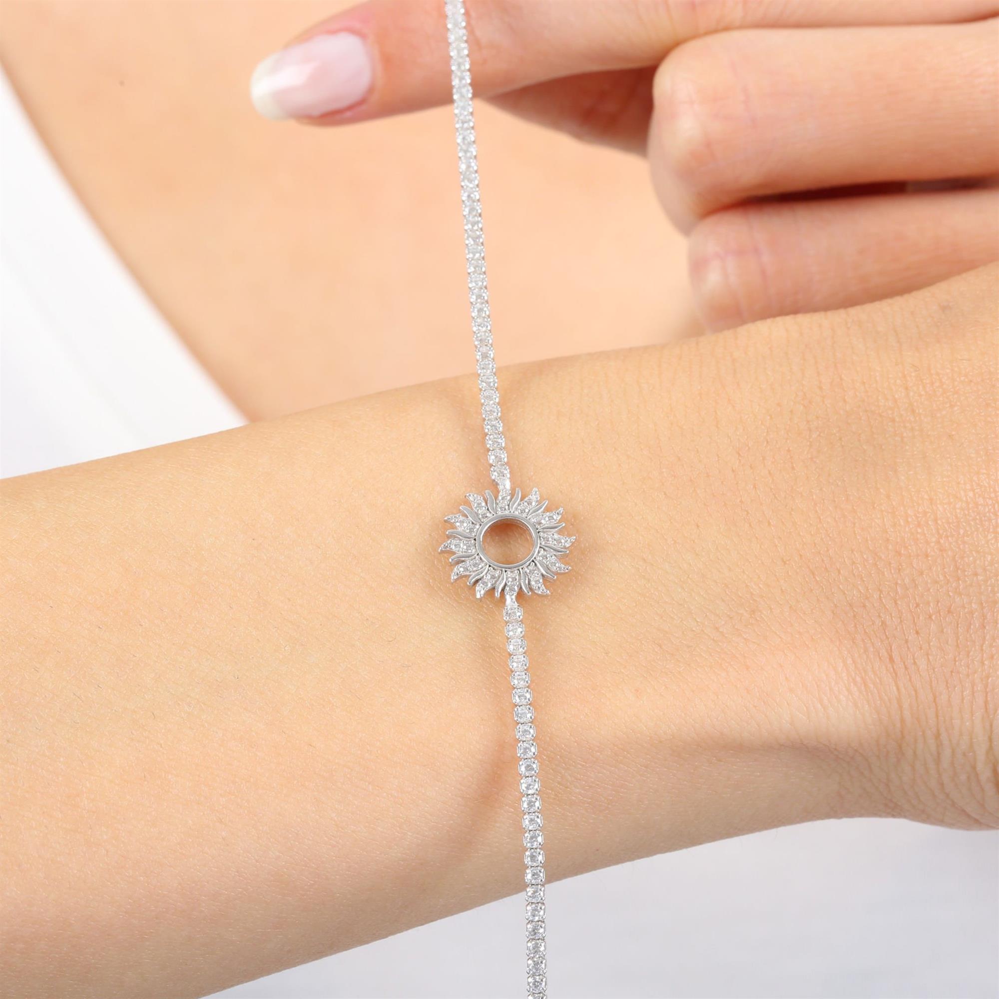 Sterling silver tennis bracelet featuring a radiant sunburst charm with sparkling CZ stones – elegant gift jewelry for women