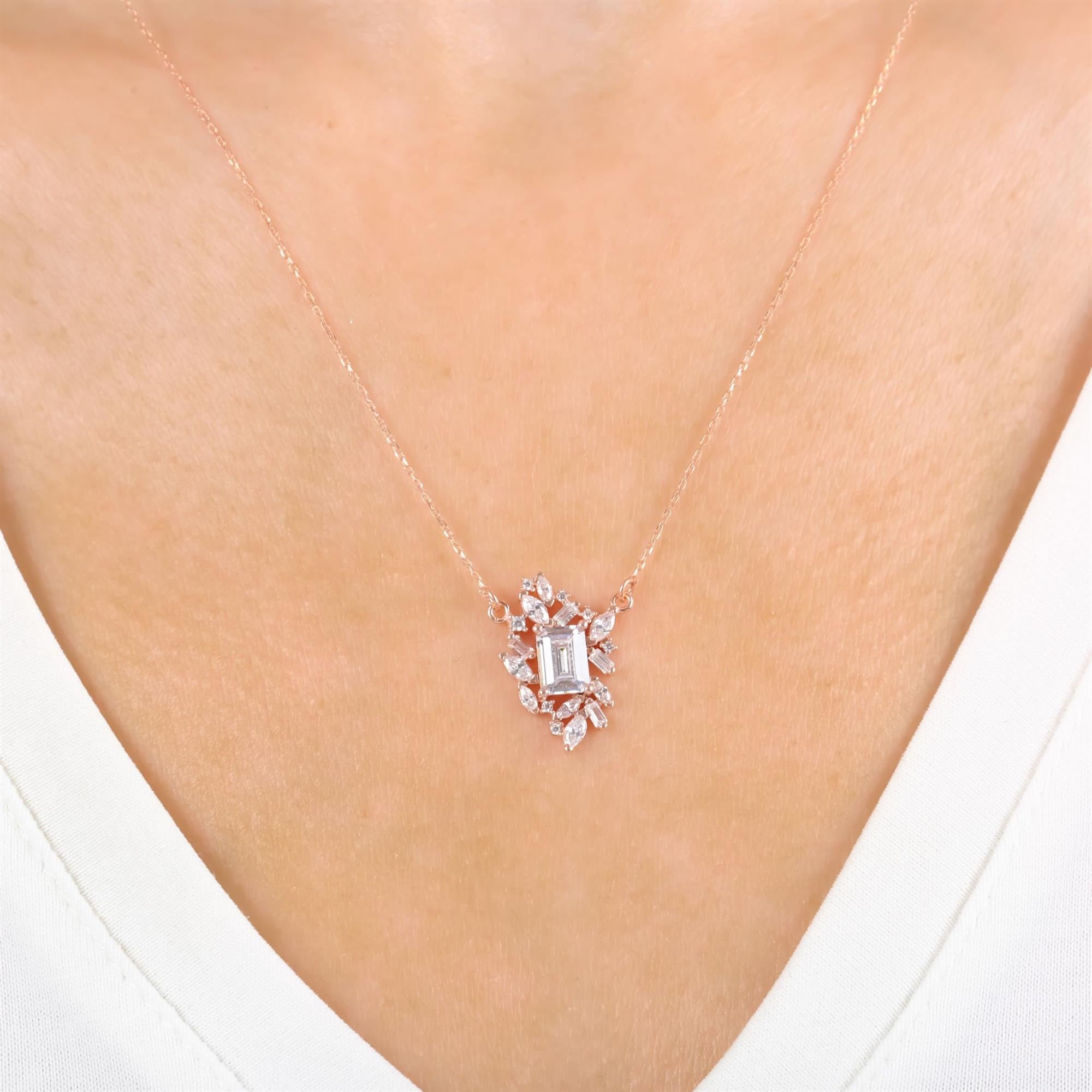 Rose gold plated sterling silver necklace with baguette-cut CZ center and marquise halo