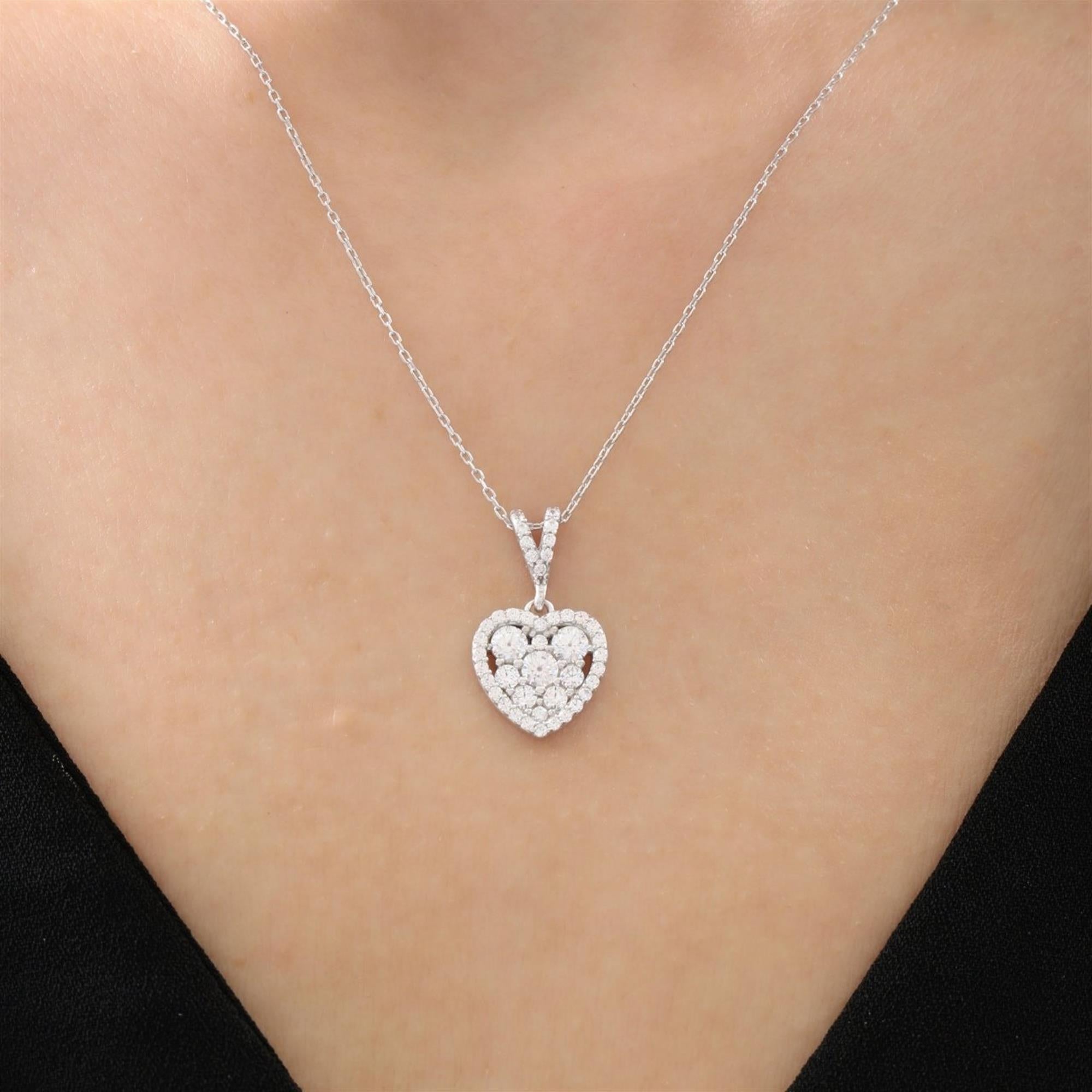 Sterling silver heart necklace with clustered sparkling zirconia stones