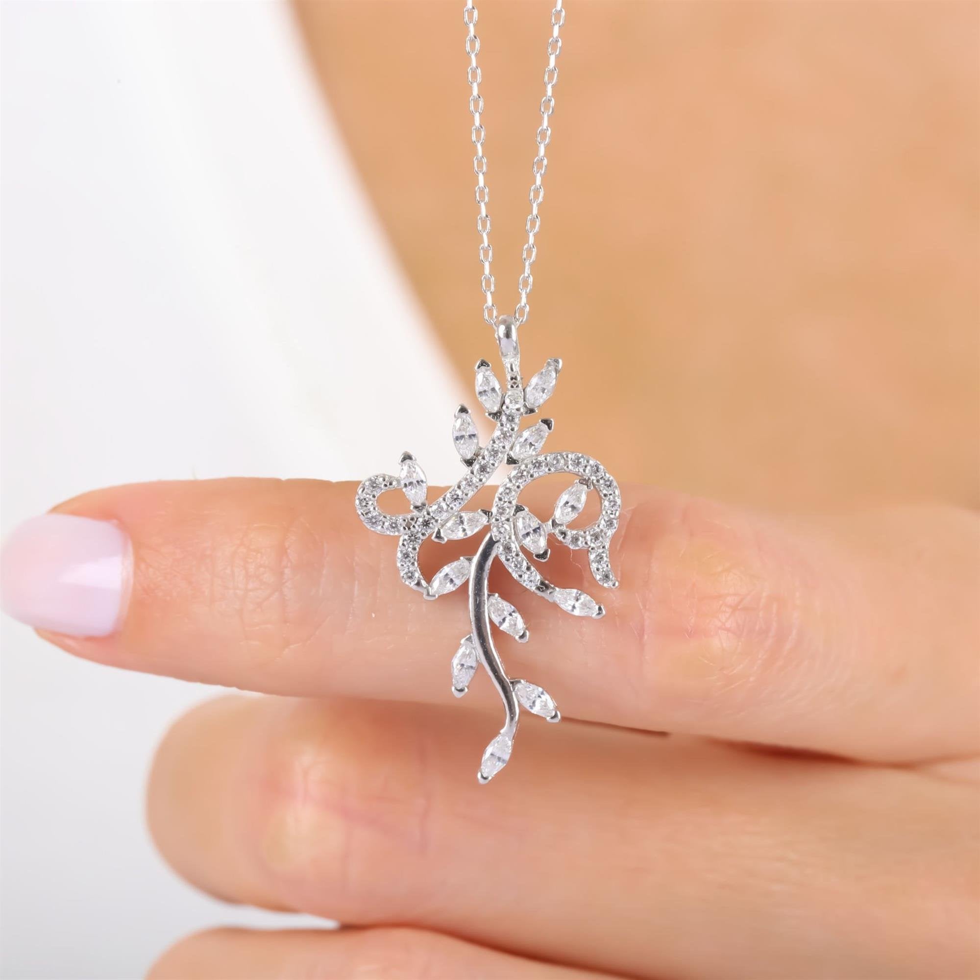 Sterling silver floral pendant necklace with vine and leaf design set in sparkling CZ – elegant and nature-inspired jewelry for women
