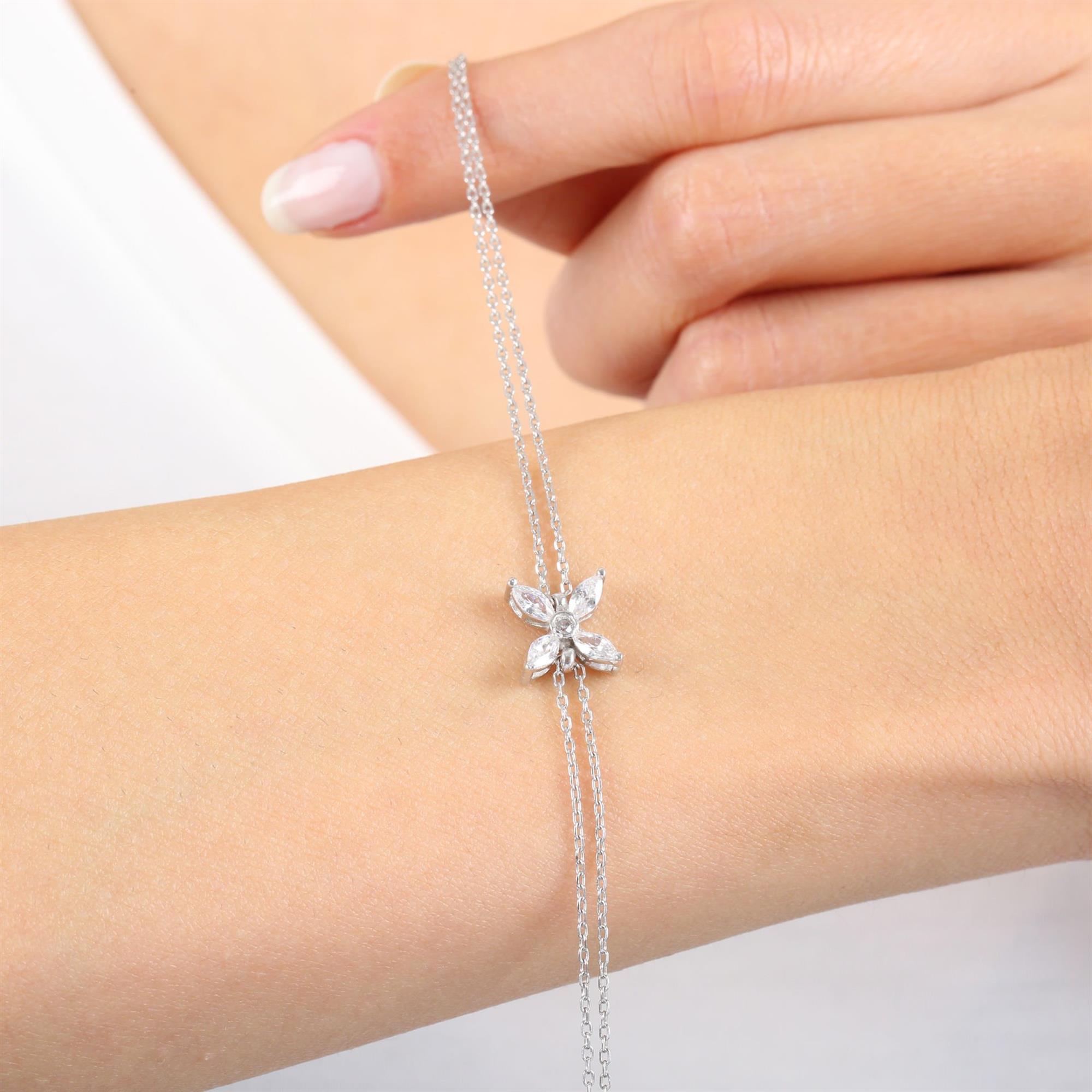 Sterling silver bracelet with marquise-cut CZ stones forming a floral charm – elegant petal design jewelry for women