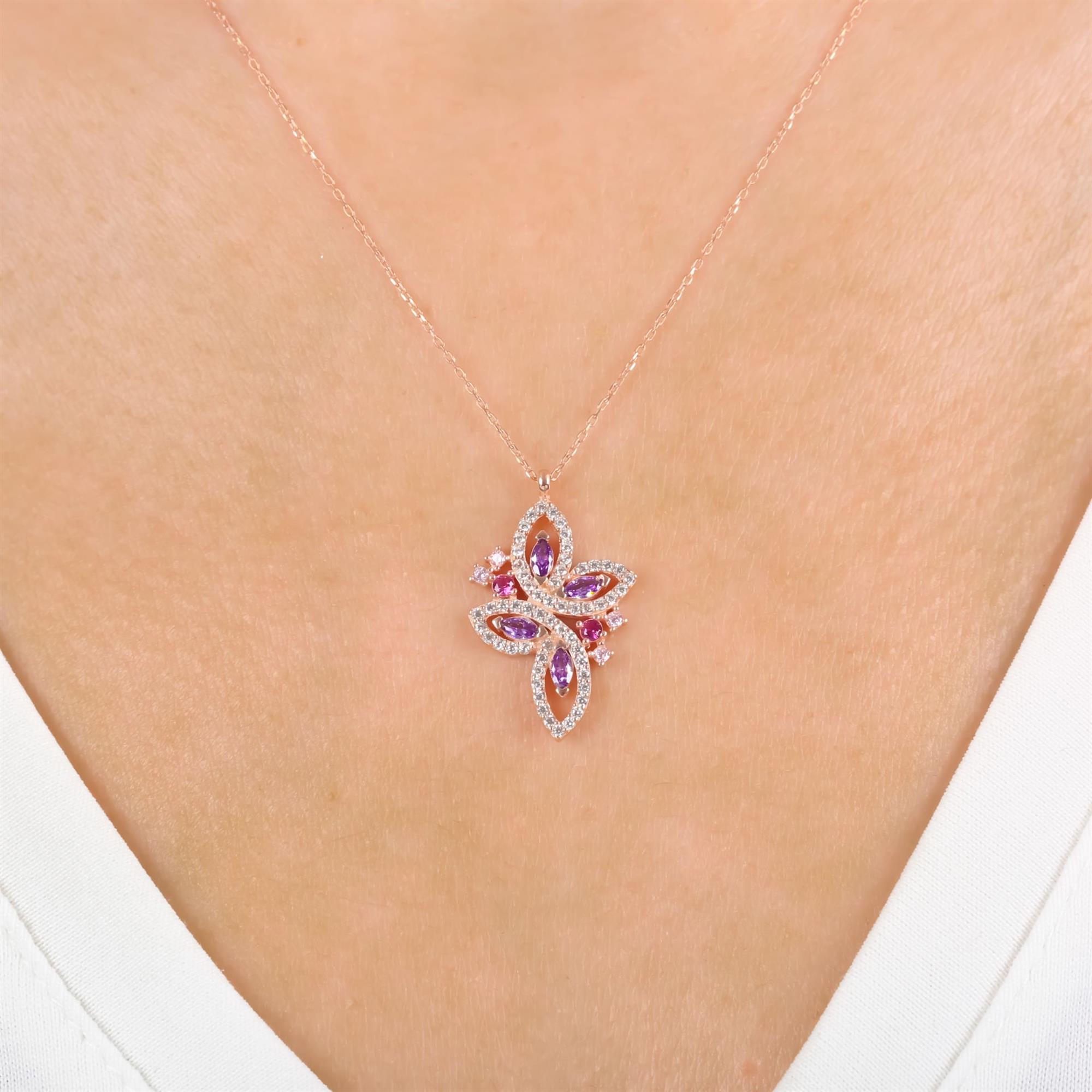 Rose gold butterfly pendant necklace with pink, purple, and clear CZ stones