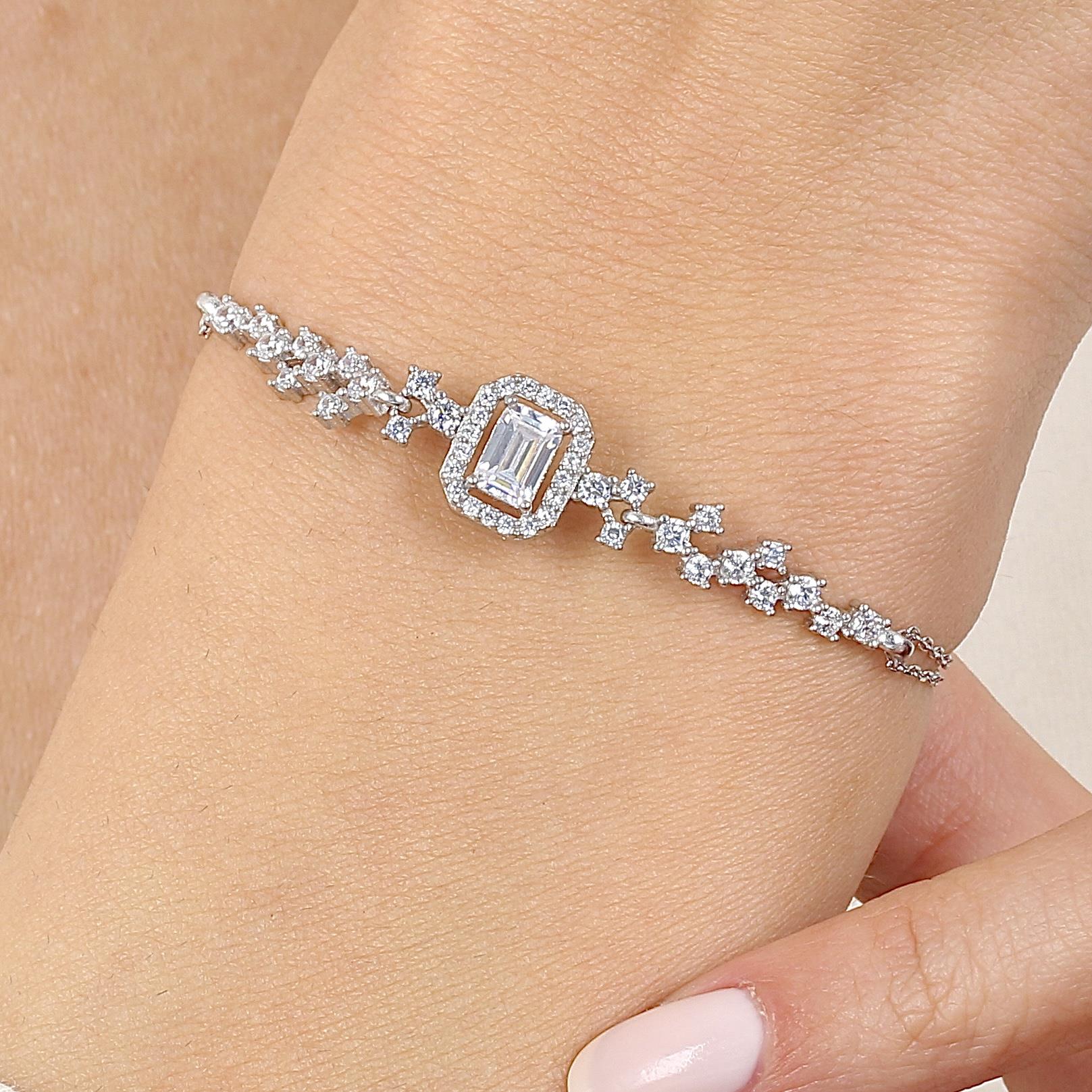 Elegant baguette-cut cubic zirconia bracelet with adjustable chain, perfect for women’s jewelry collection.