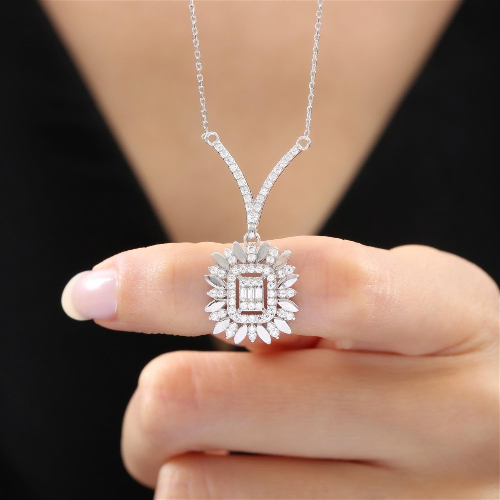 Radiant sunburst pendant necklace with baguette, marquise, and round-cut CZ stones in sterling silver tone – bold statement sparkle for women