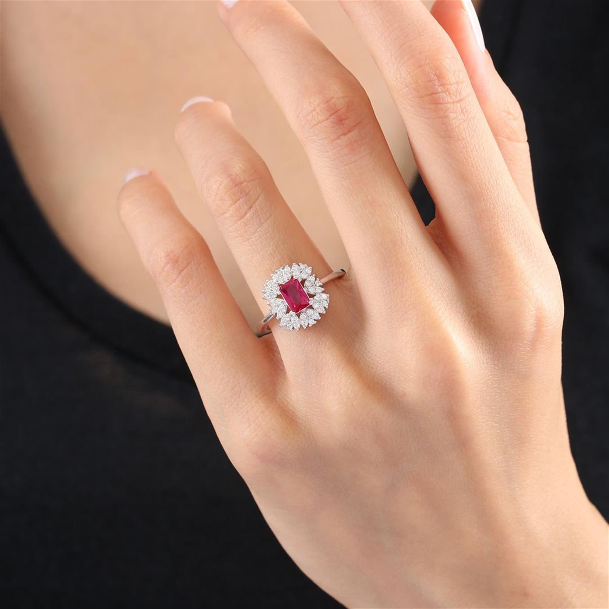 Silver ring with baguette-cut synthetic ruby and sparkling zircon halo