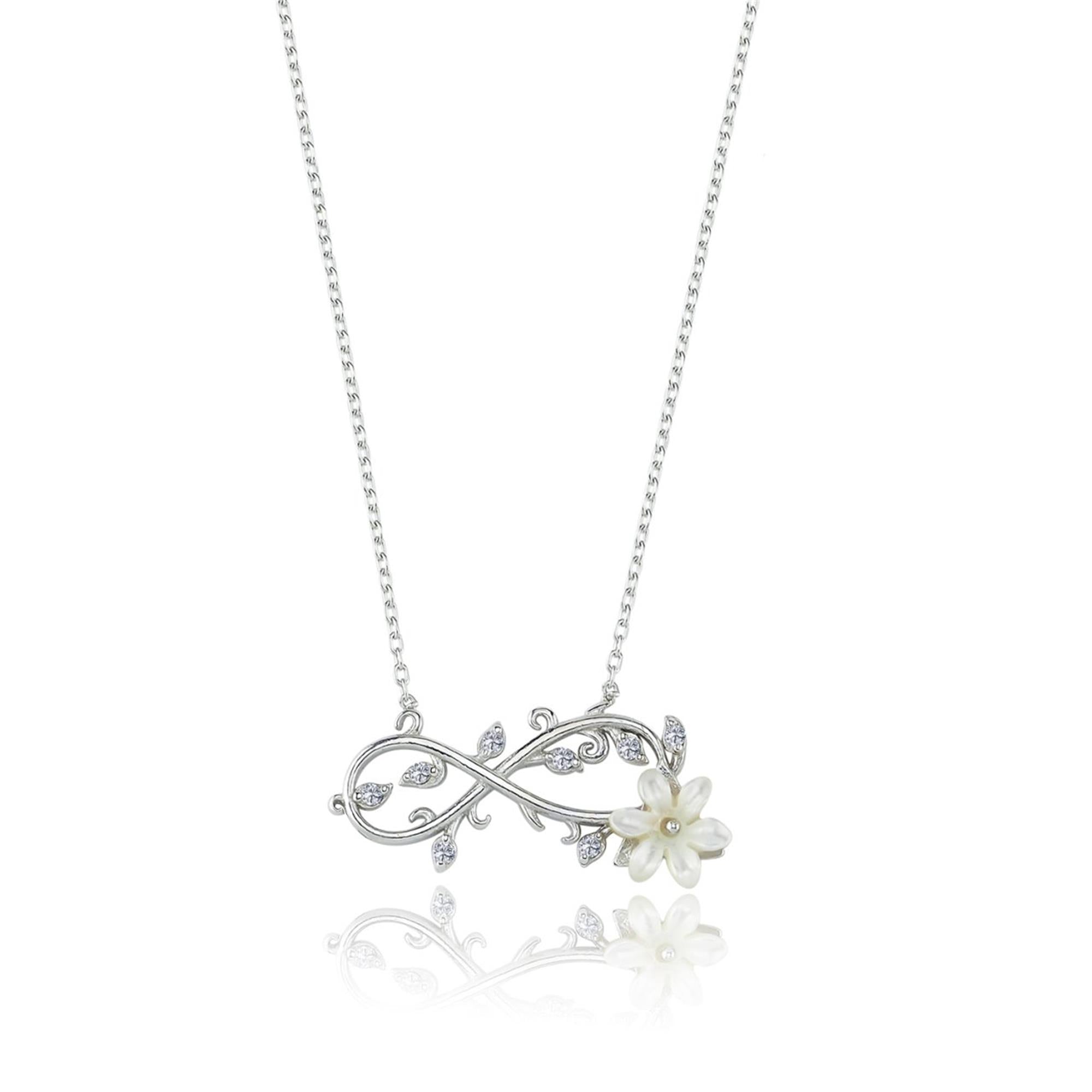 Collar infinito en plata con flor blanca de magnolia y hojas brillantes