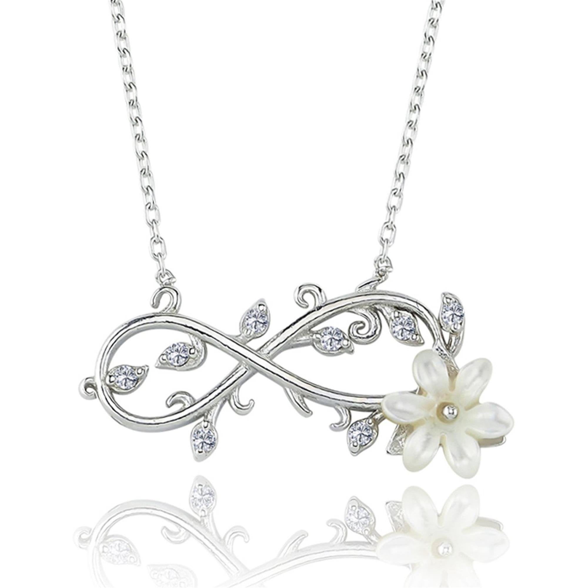 Silver infinity necklace with white magnolia flower and crystal-studded leaf vine design