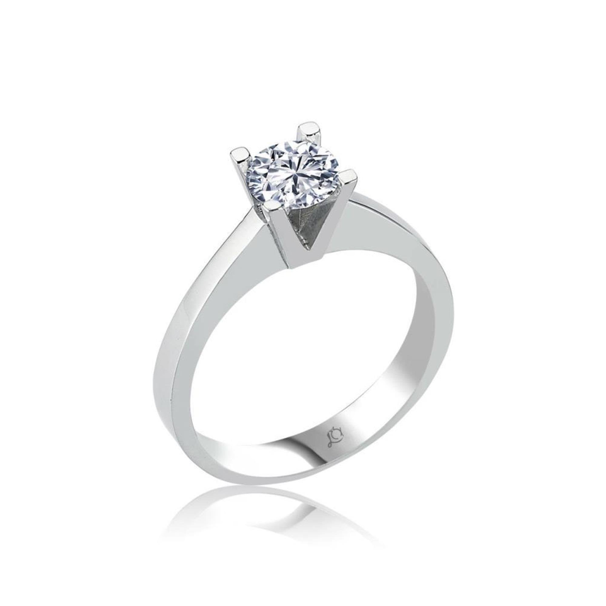 Minimalist sterling silver solitaire ring featuring a brilliant Swarovski stone in a sharp V-cut prong setting.