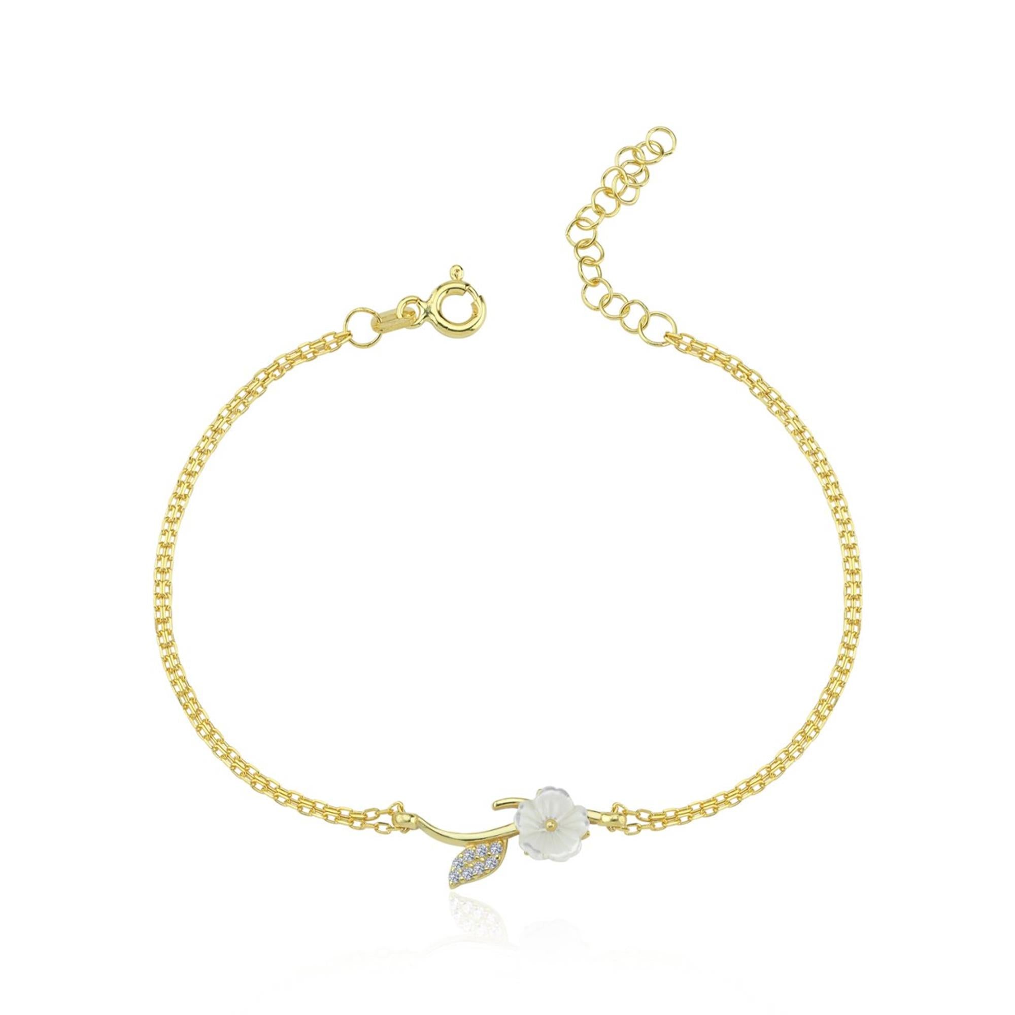 Gold-tone floral bracelet with white carved magnolia and CZ leaf charm – nature-inspired dainty design