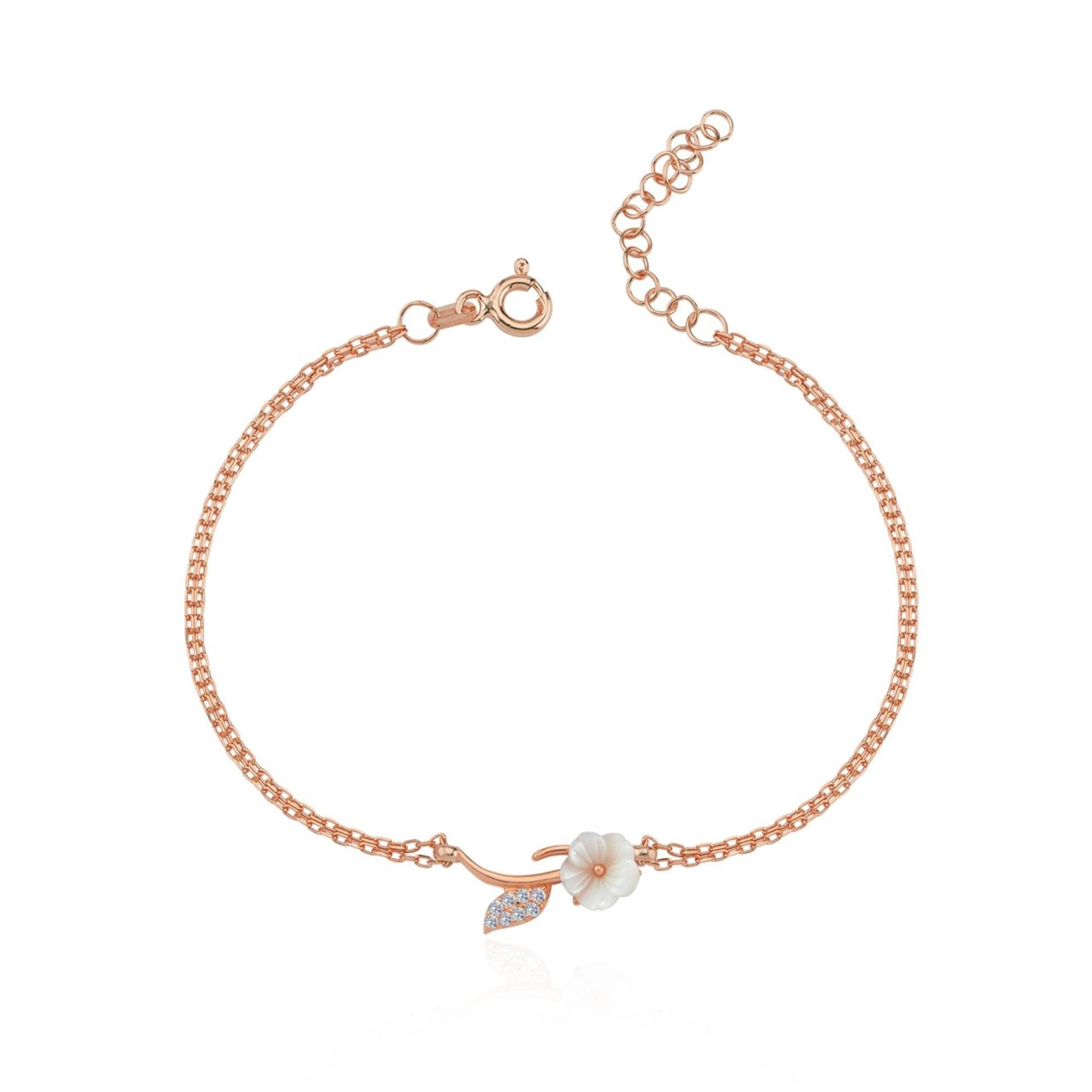 Rose gold bracelet with white magnolia flower and sparkling leaf on a double chain