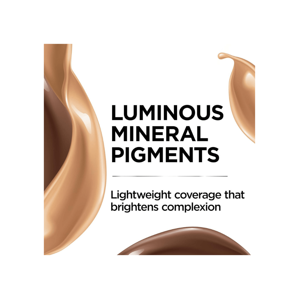 Clear bottle with a gold dropper lid, filled with a warm-toned liquid makeup.