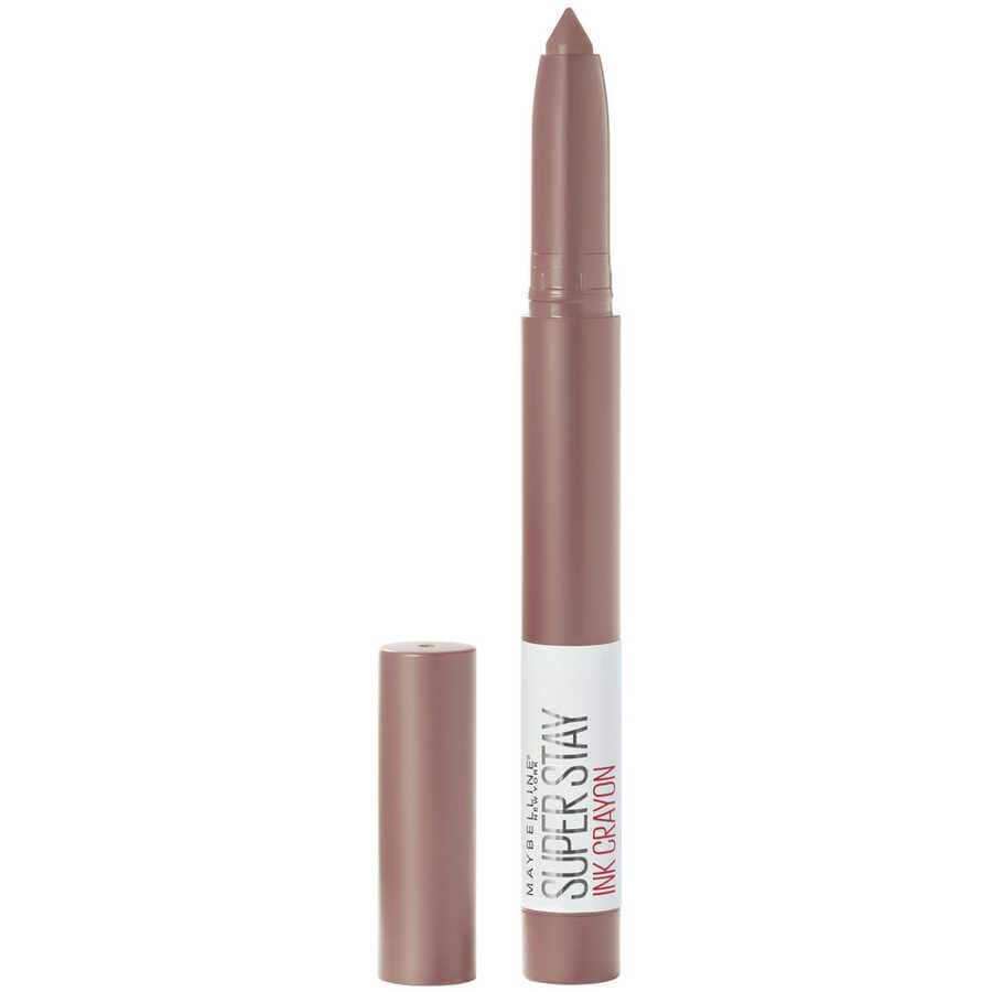 Close-up of a sleek, matte beige lipstick crayon with a pointed tip, labeled for long-lasting wear.