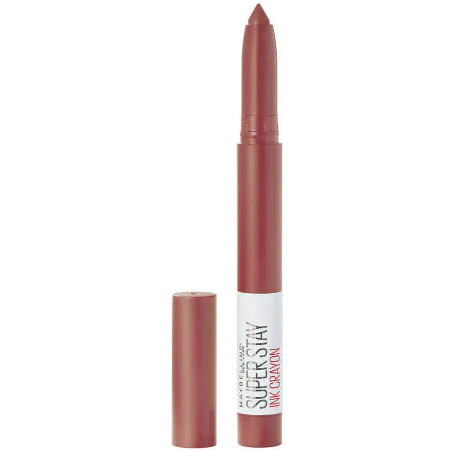 Close-up of a Maybelline lipstick crayon with a pinkish-brown shade.