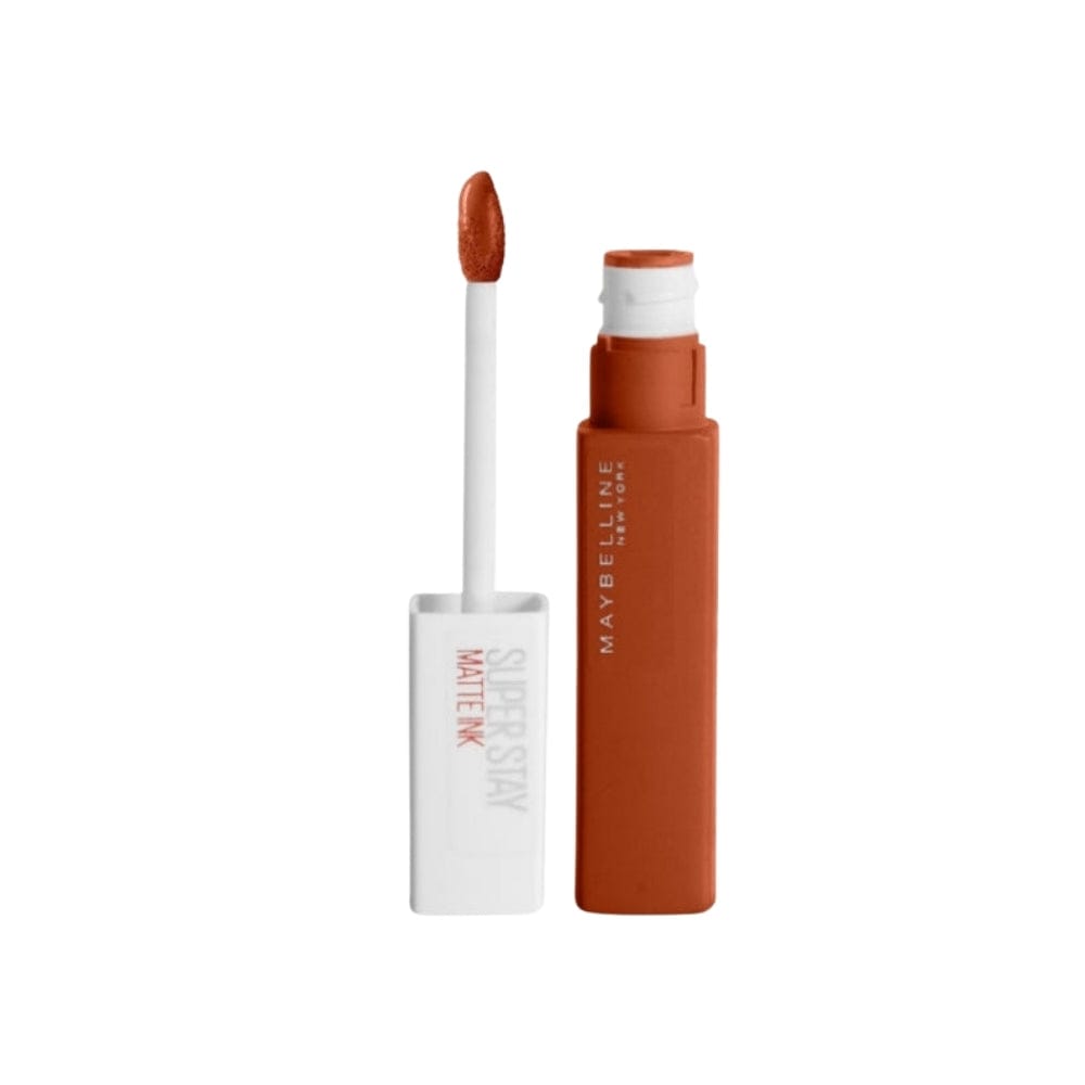 Close-up of a brown Maybelline lipstick tube labeled 'Super Stay Matte Ink', shade 135 Globetrotter.