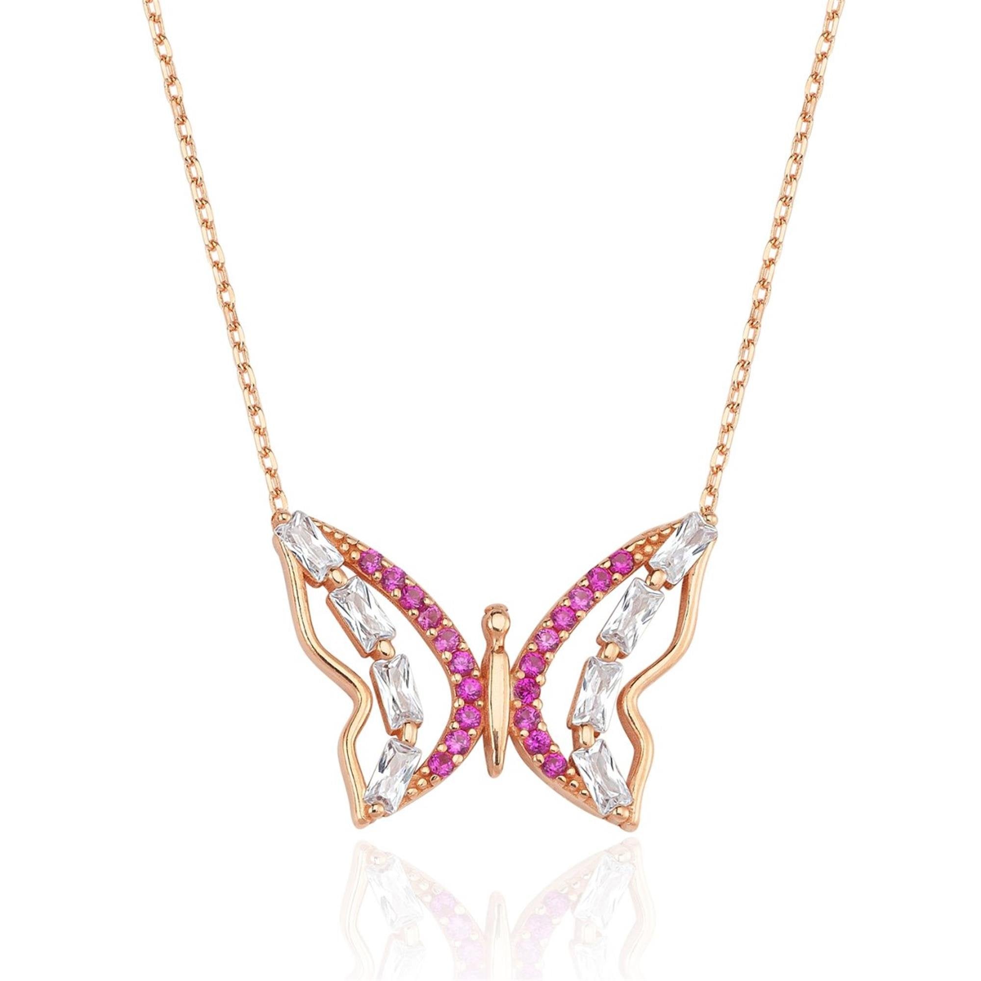Rose gold butterfly necklace with fuchsia cubic zirconia and baguette white stones – a joyful and elegant symbol of nature and freedom.