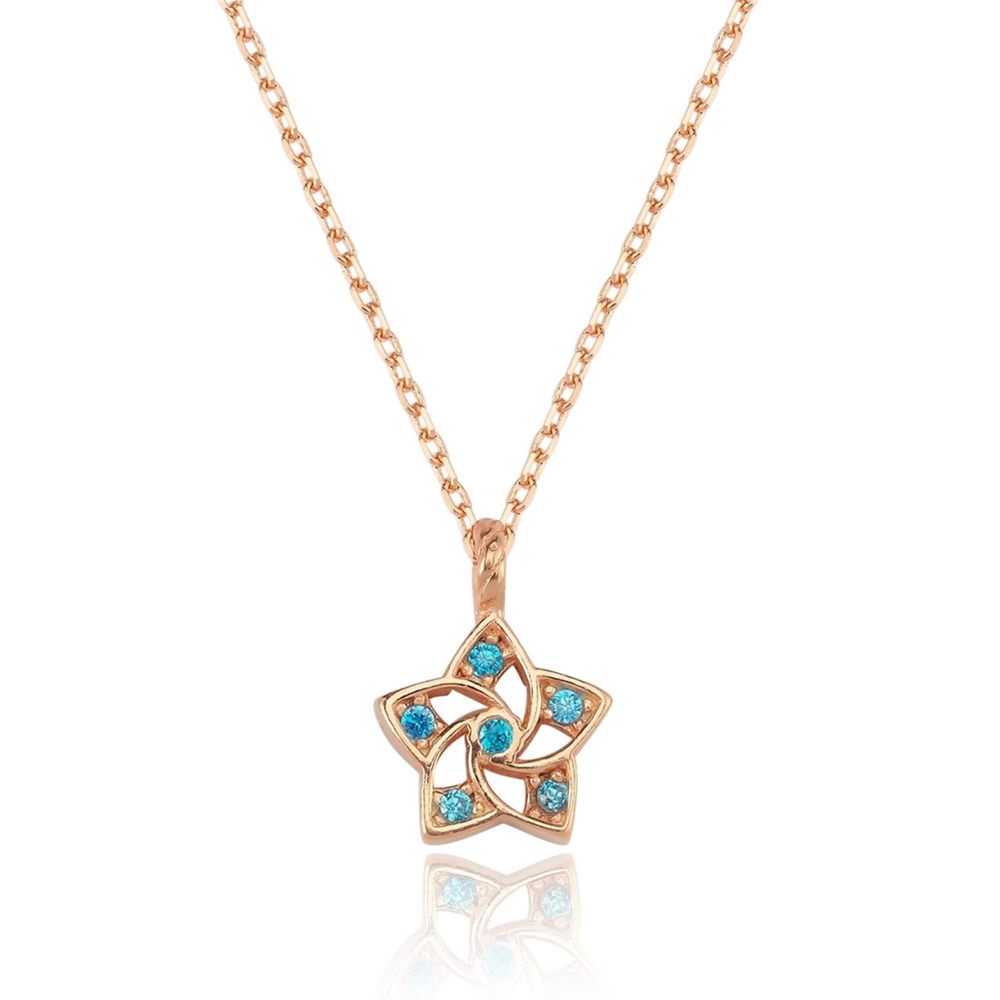 Rose gold star necklace with aqua cubic zirconia – a minimalist piece combining elegance and freshness.