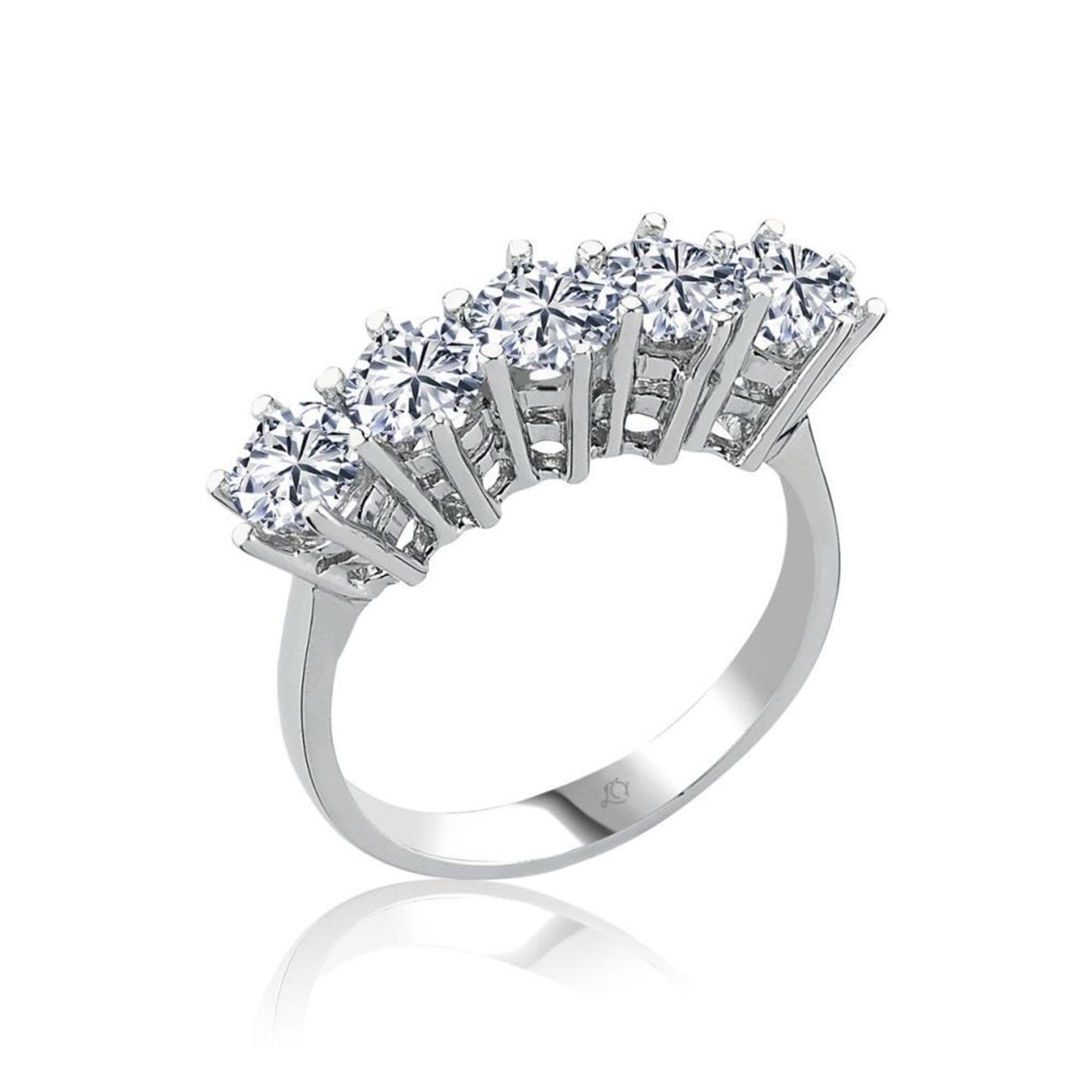 White gold plated silver ring featuring seven dazzling zircon stones arranged in a tiara-inspired crown design – perfect for special moments.