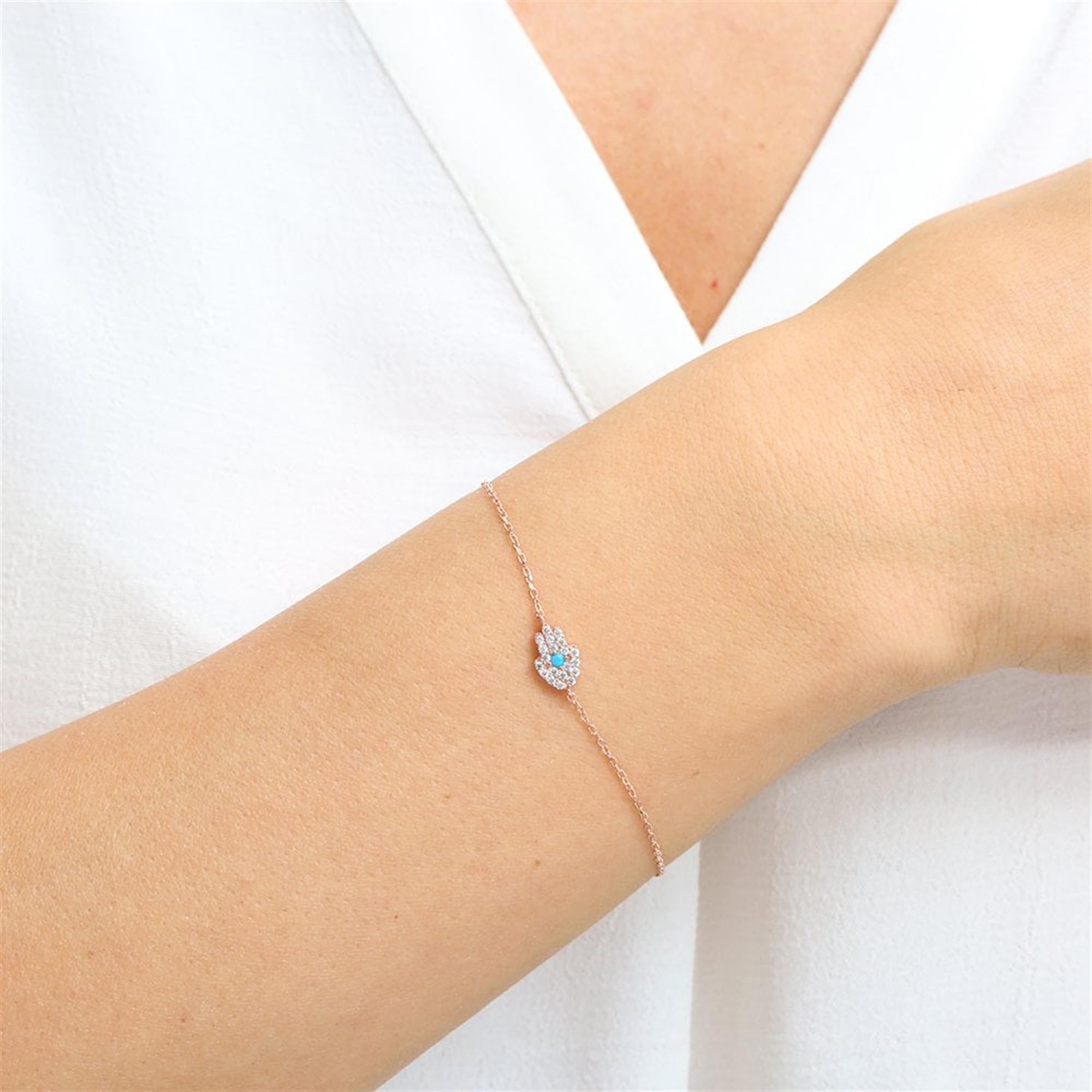 Rosévergoldetes Hamsa-Armband mit Türkisstein – Schutzsymbol in stilvollem Silberdesign.