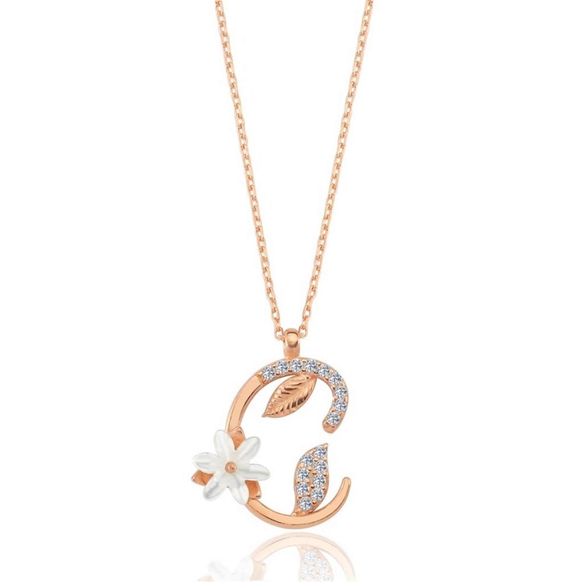 Rose gold letter C necklace featuring a magnolia flower and sparkling cubic zirconia stones – a personal and floral gift for her.