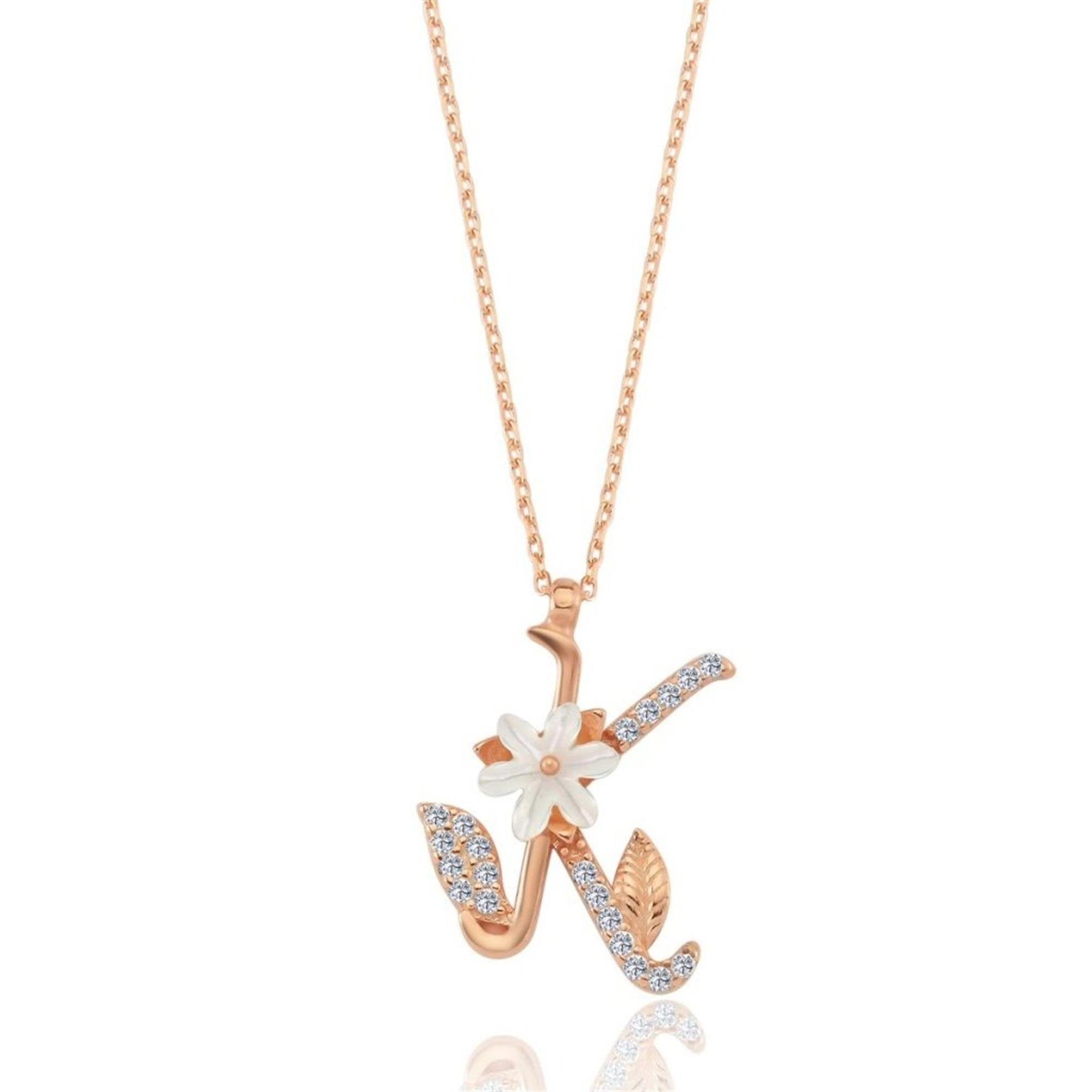 Rose gold letter K necklace featuring a magnolia flower and sparkling cubic zirconia stones – a personal and floral gift for her.