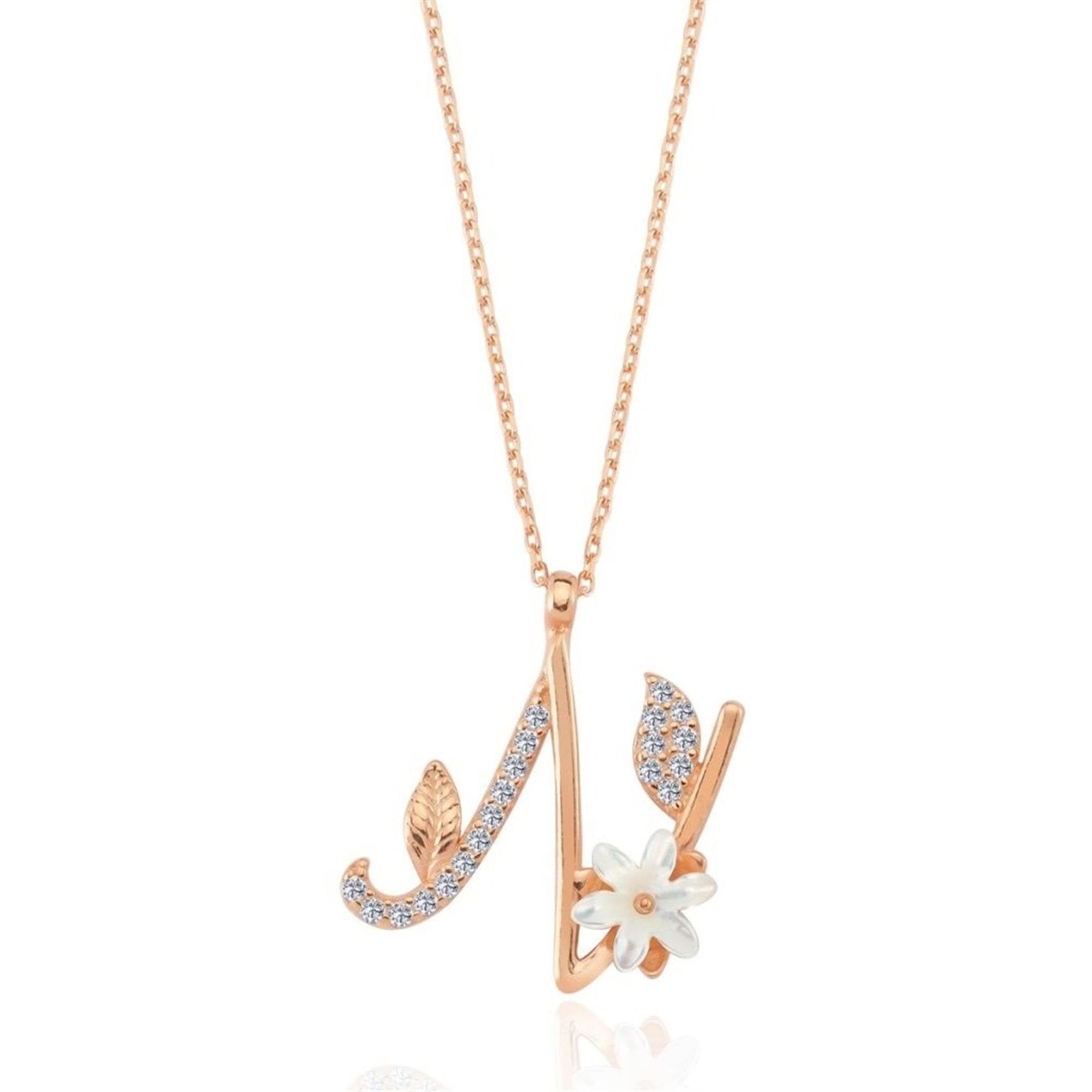 Rose gold "N" letter necklace with cubic zirconia stones, a mother-of-pearl flower, and leaf detailing – a personalized floral pendant.