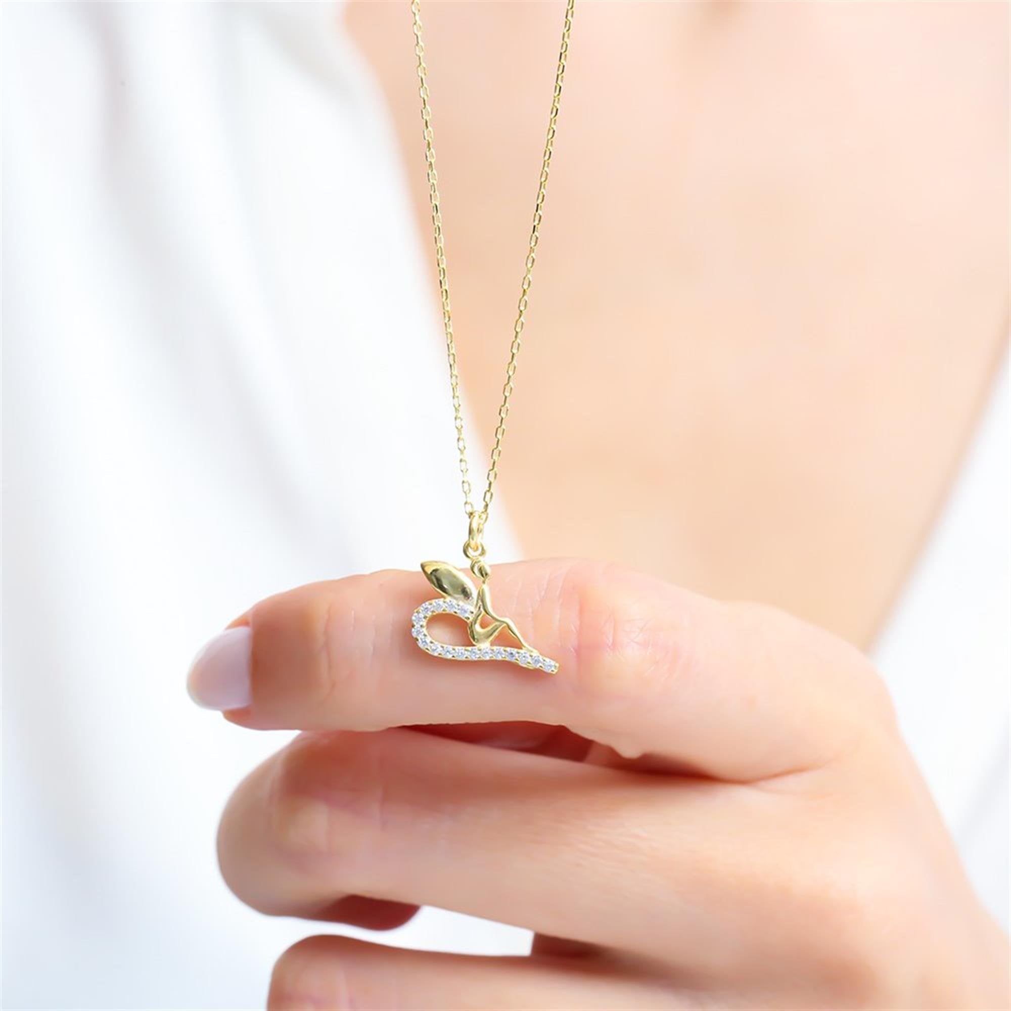 Gold plated sterling silver fairy necklace with shimmering zircon curve – a magical and dreamy everyday pendant.
