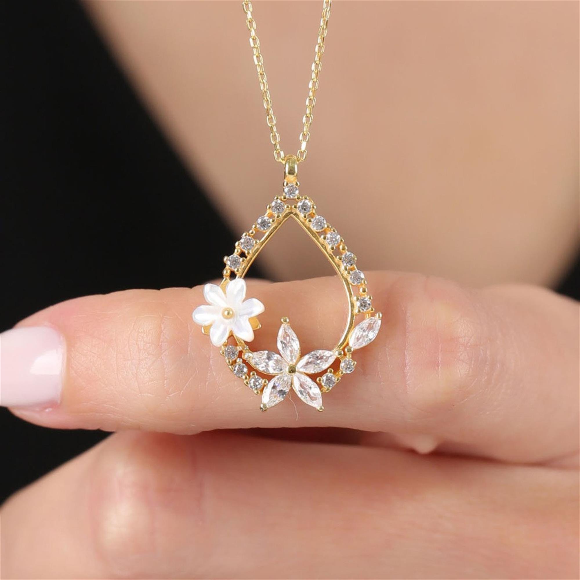 gold teardrop necklace with CZ stones and magnolia flower design – elegant floral pendant for women