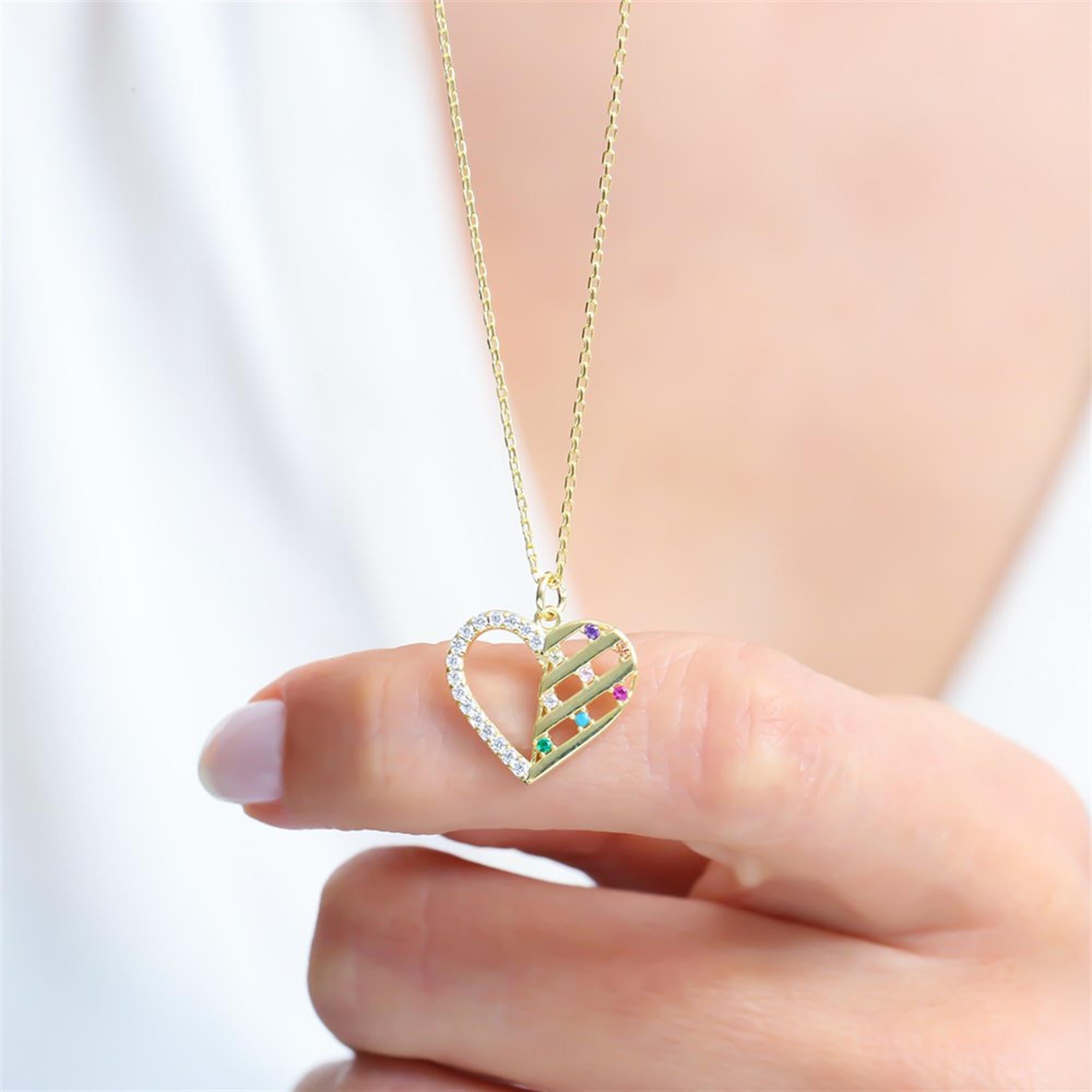 Gold heart necklace with multicolored stones and zirconia accents – a radiant piece that celebrates colorful love.