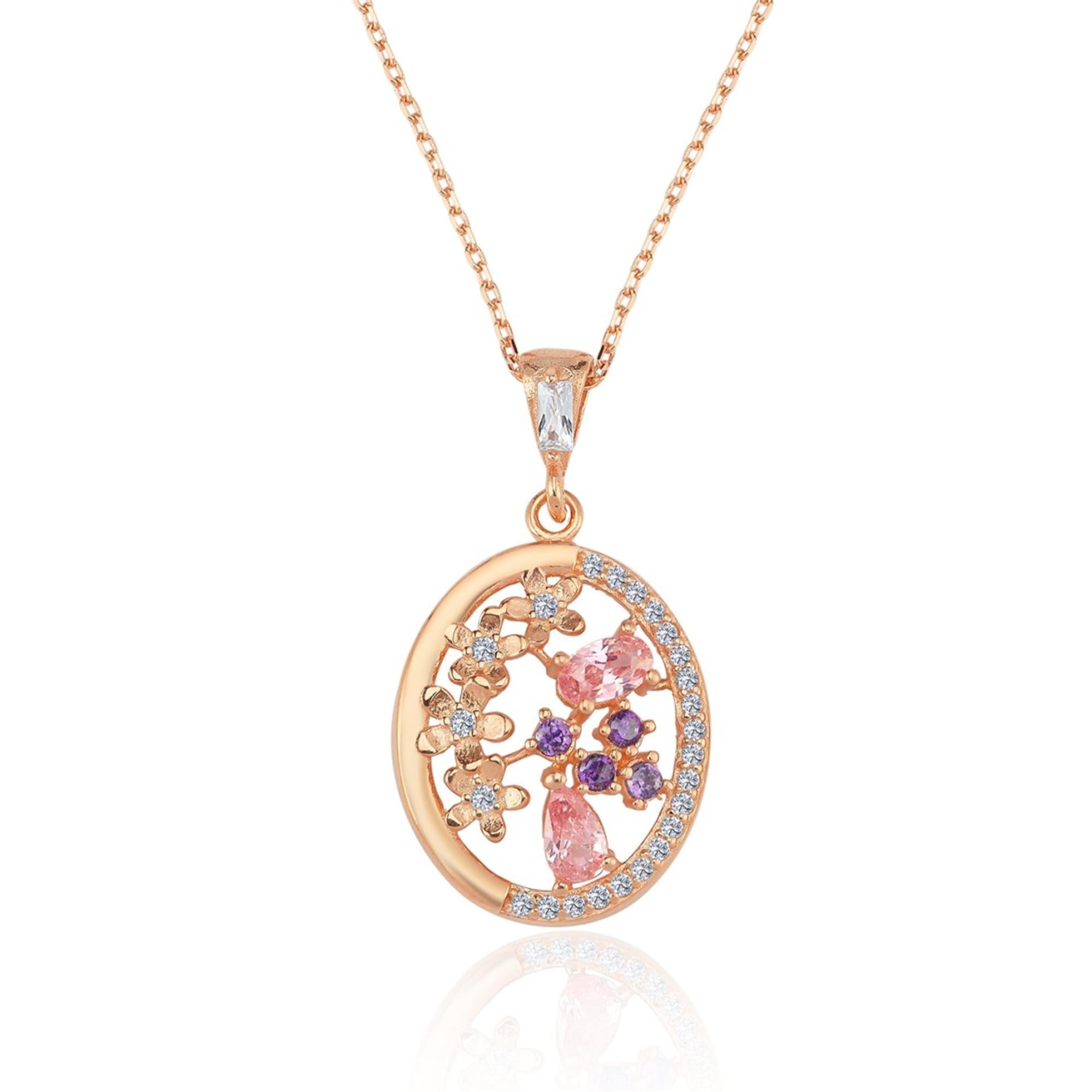 Collar con colgante ovalado en oro rosa con circonitas rosas, moradas y blancas – inspirado en jardines reales y elegancia floral.