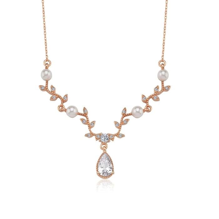 Elegant rose gold jewelry set with pearls, CZ leaf details, and teardrop stones – bridal necklace and earrings for women
