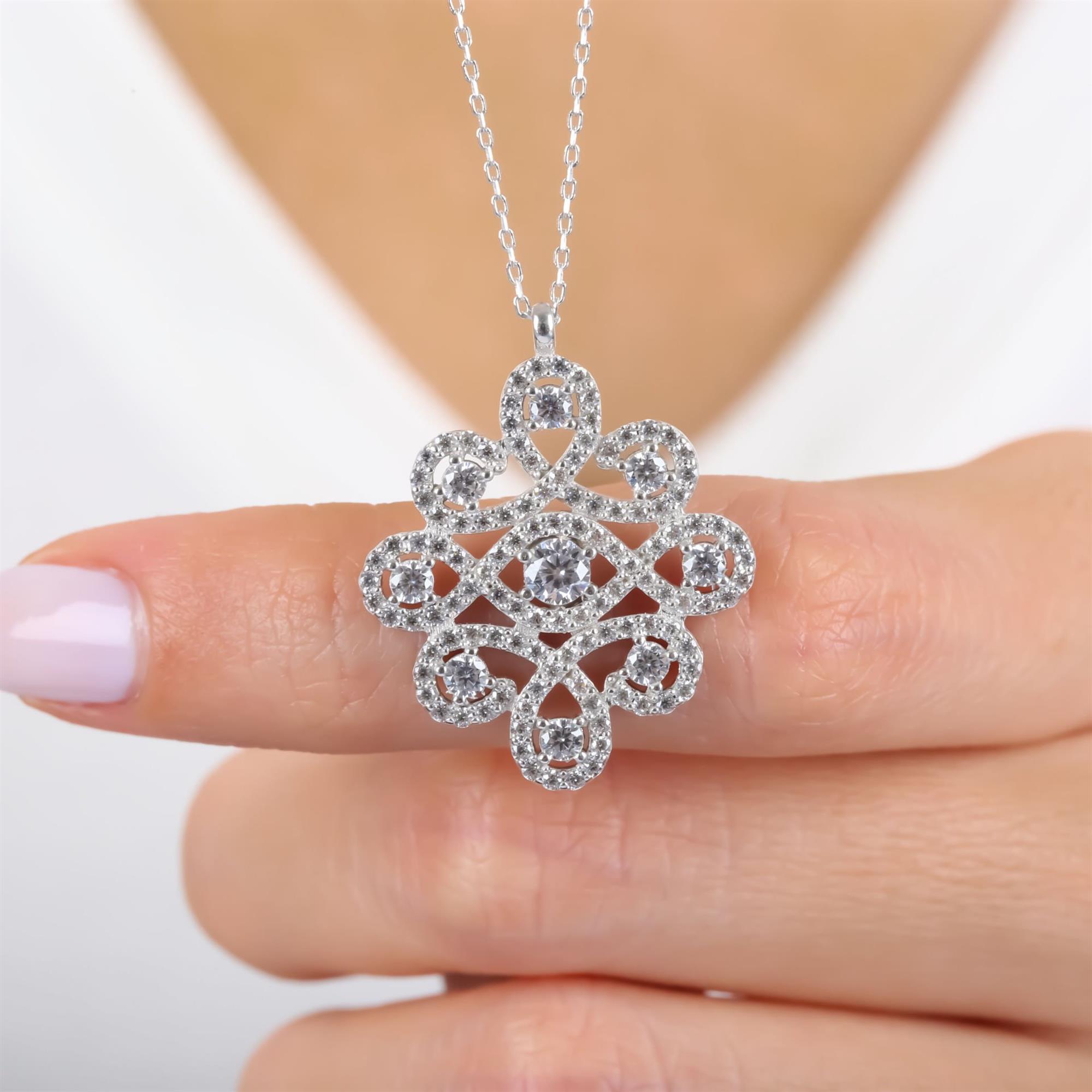 Sterling silver infinity knot necklace with CZ stones – elegant loop pendant symbolizing eternal love and connection