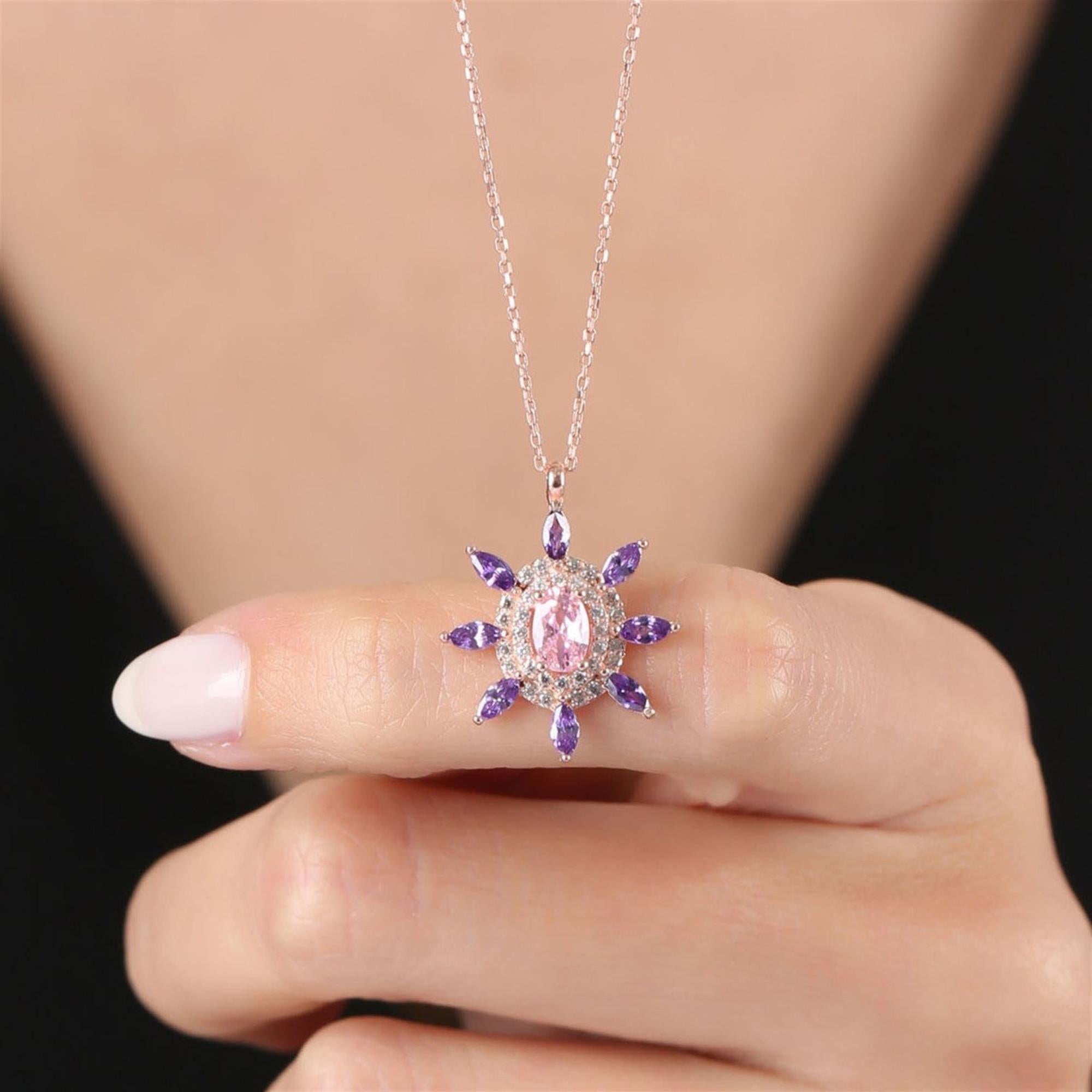 Sunburst pendant necklace with pink center stone and purple CZ in rose gold – vibrant statement jewelry for women